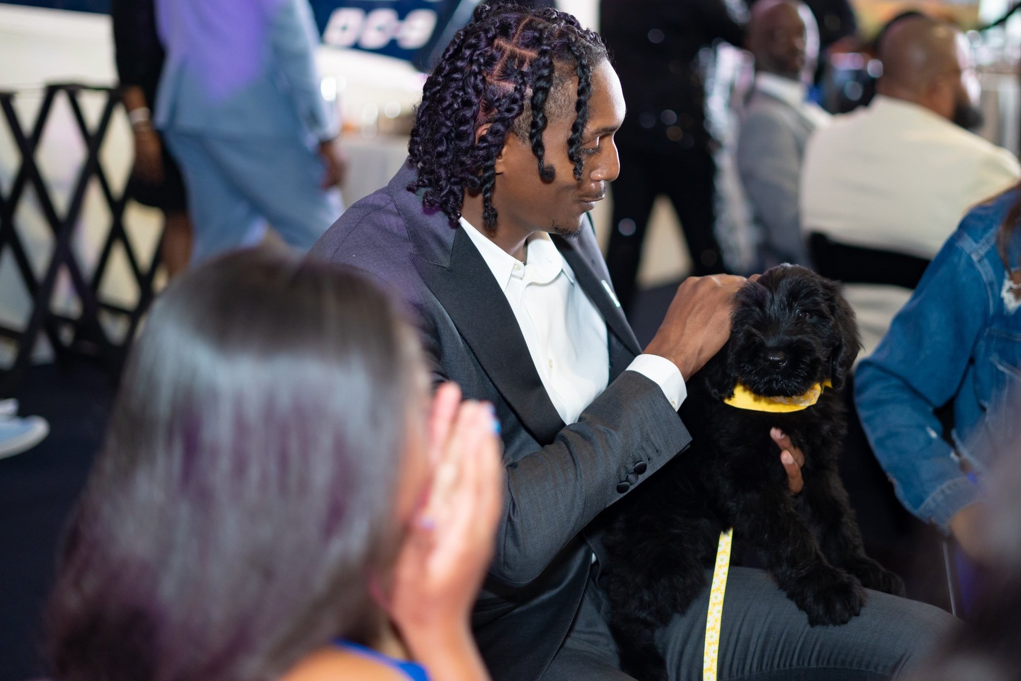 Lou Williams, Former NBA player won a Puppy during a live auction at the 2023 RCF Father/Daughter Sneaker Ball.