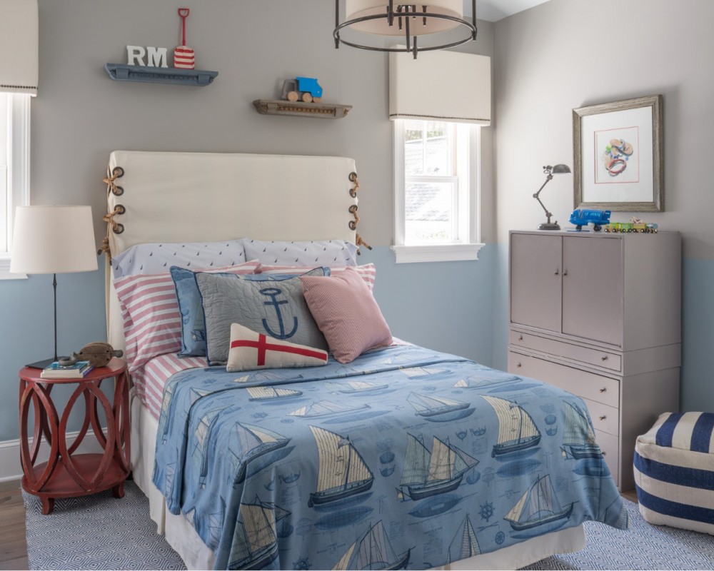A boy’s bedroom in a nautical theme is just right for a beach house.