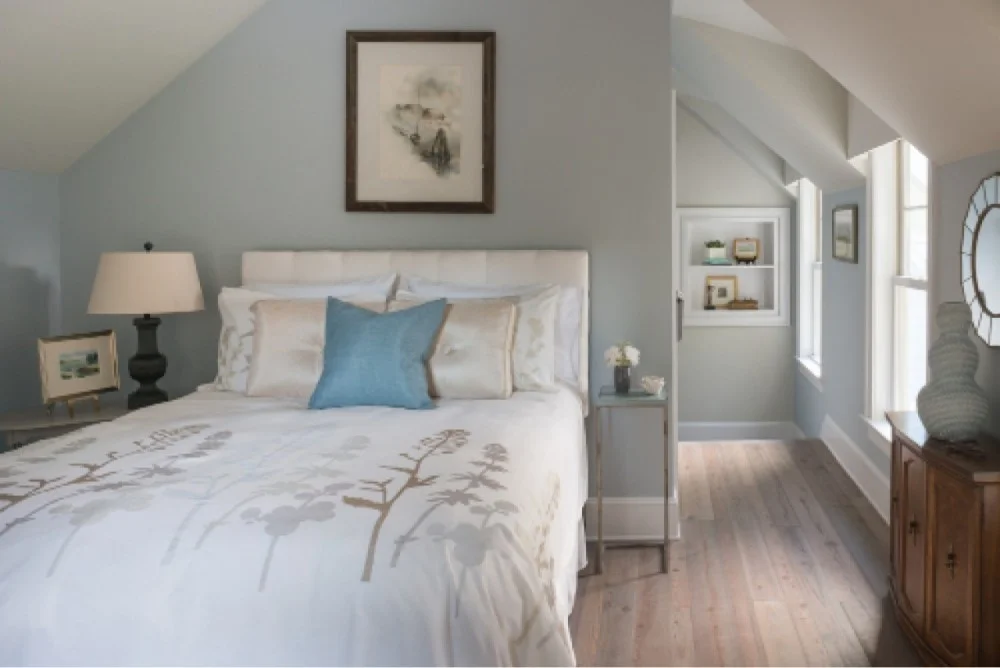 The carriage house suite serves as welcoming guest quarters, with its soft colors and cozy, coved ceiling.