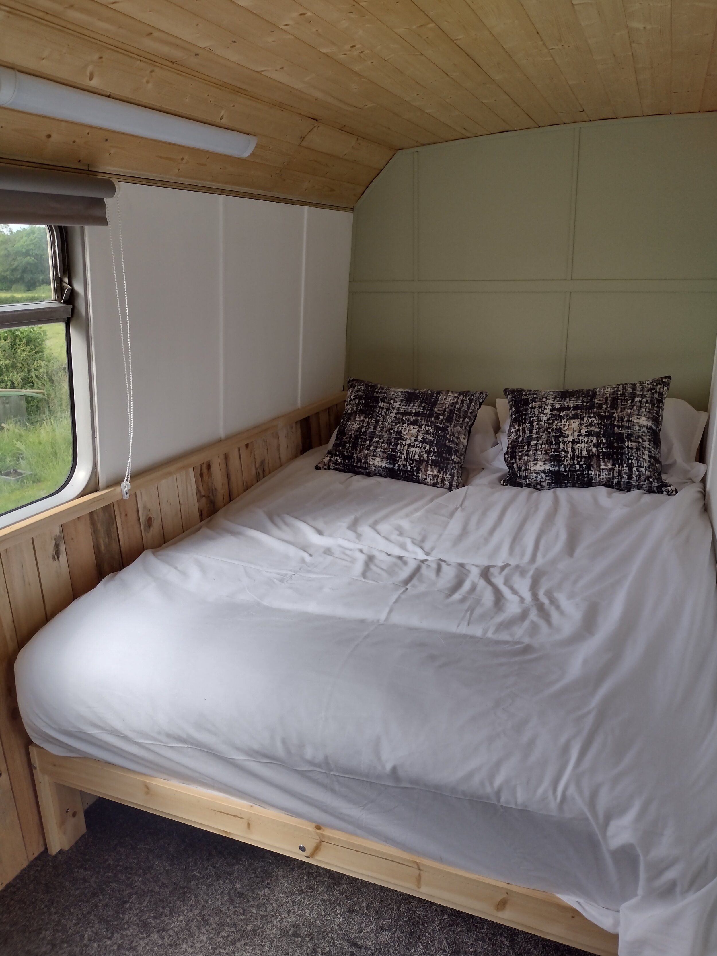 Stanford Farm's double decker bus conversion upstairs bedroom 2