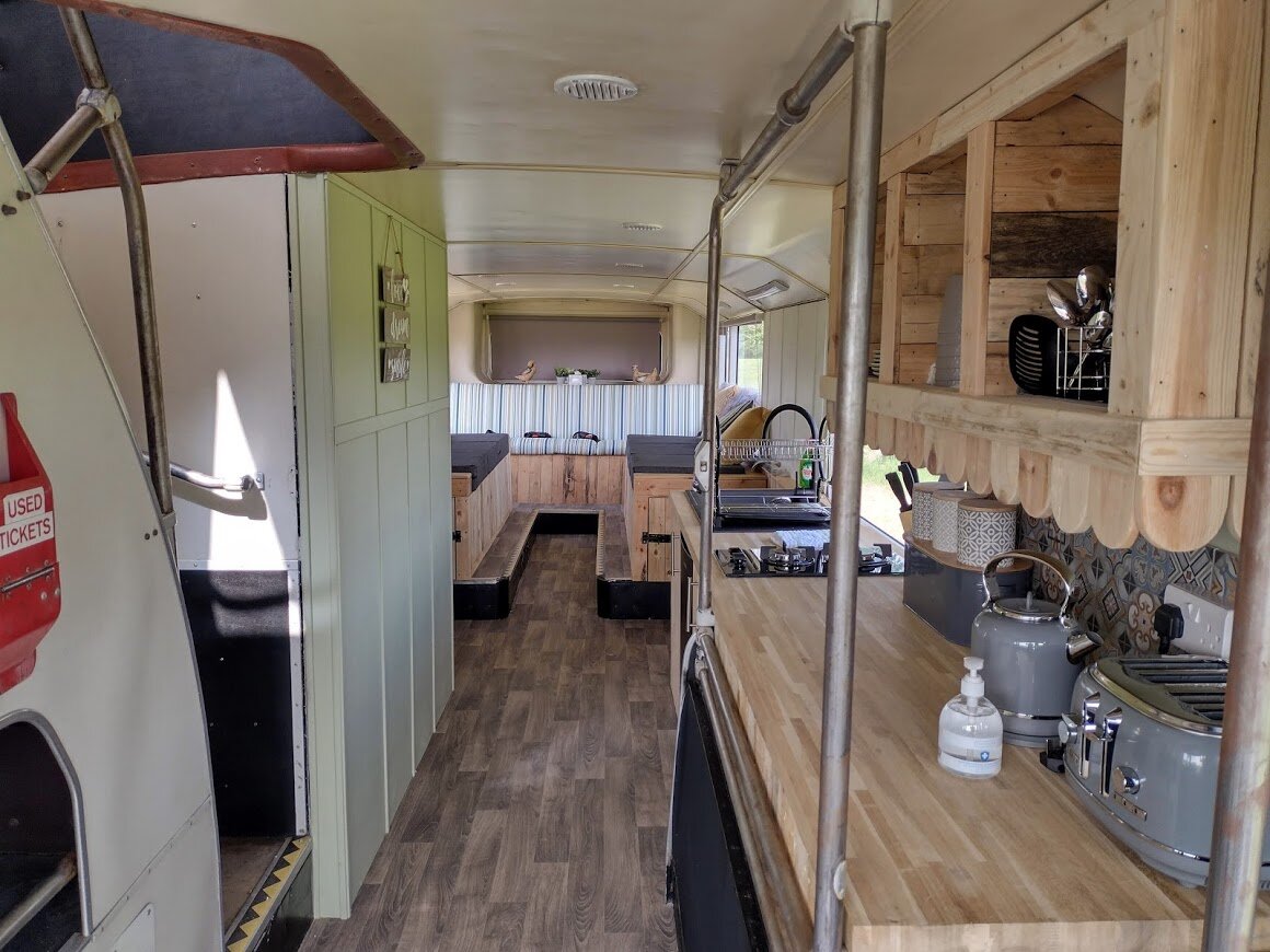 Stanford Farm's double decker bus conversion lounge and kitchen