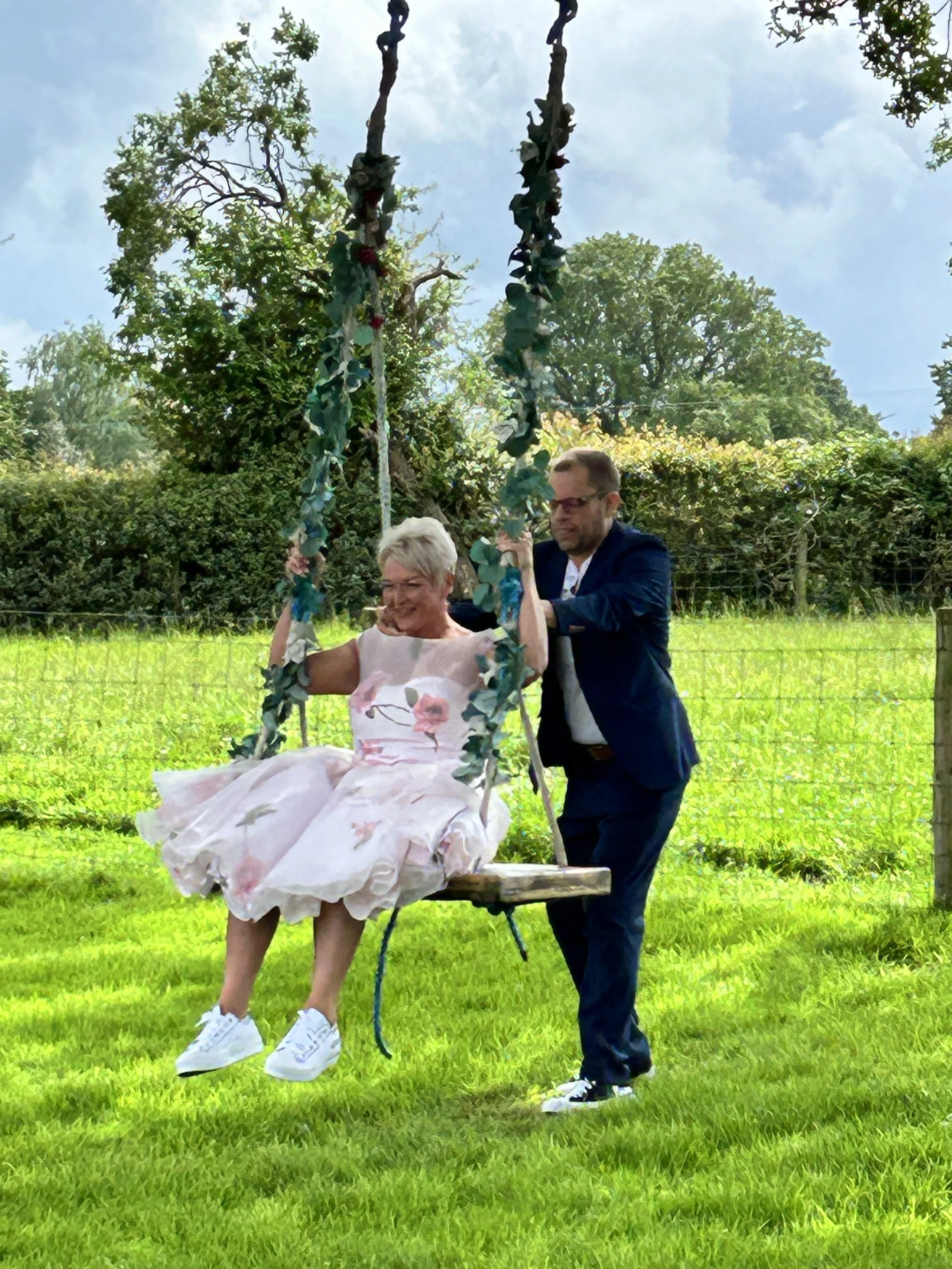 Wedding swing in the Farmhouse garden at Karen and Steve's 4 day Wedding at Stanford Farm in Shropshire 25th May 2024