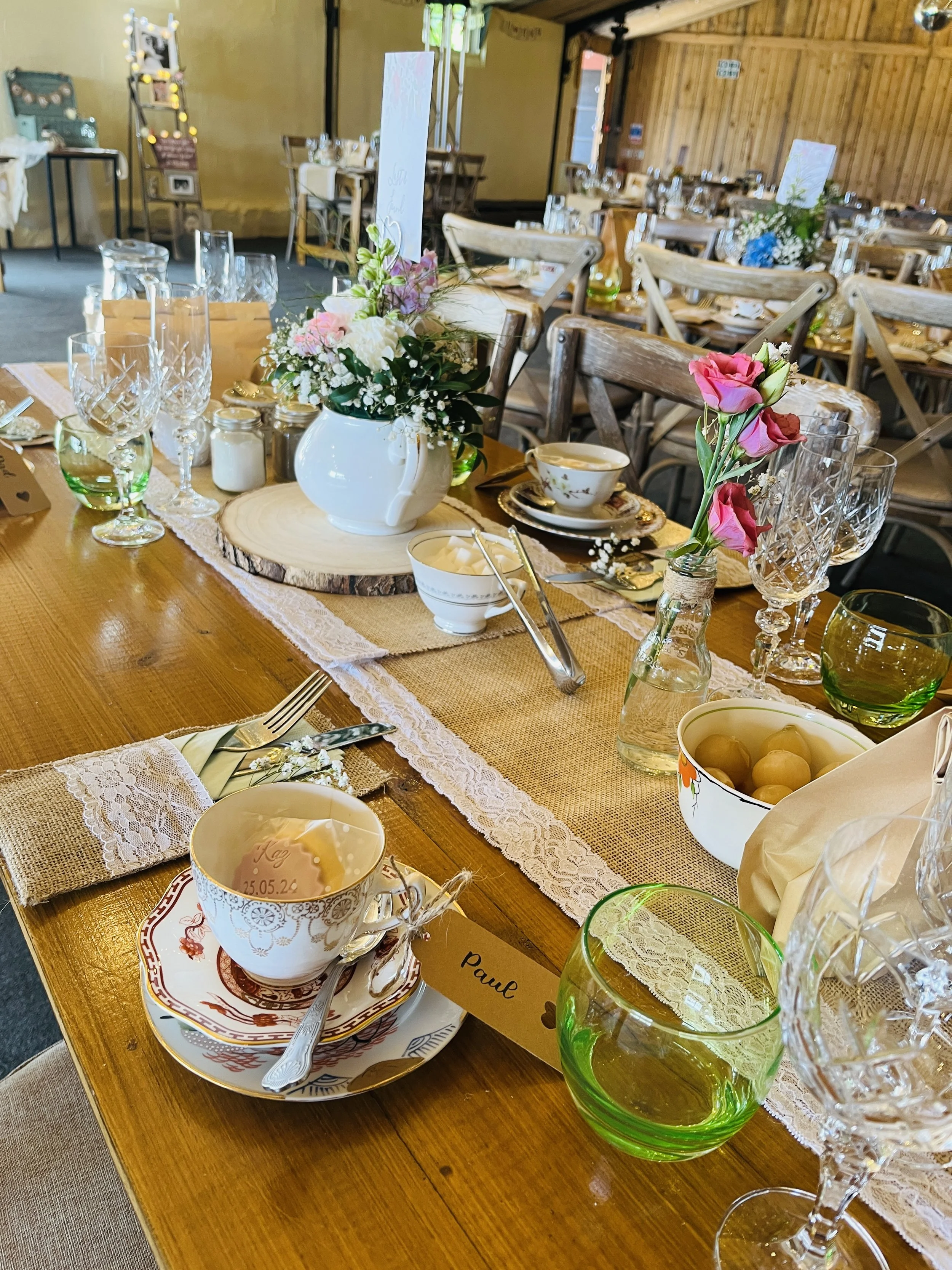 Tables decorated in our Cowhouse for Karen and Steve's 4 day Wedding at Stanford Farm in Shropshire 25th May 2024