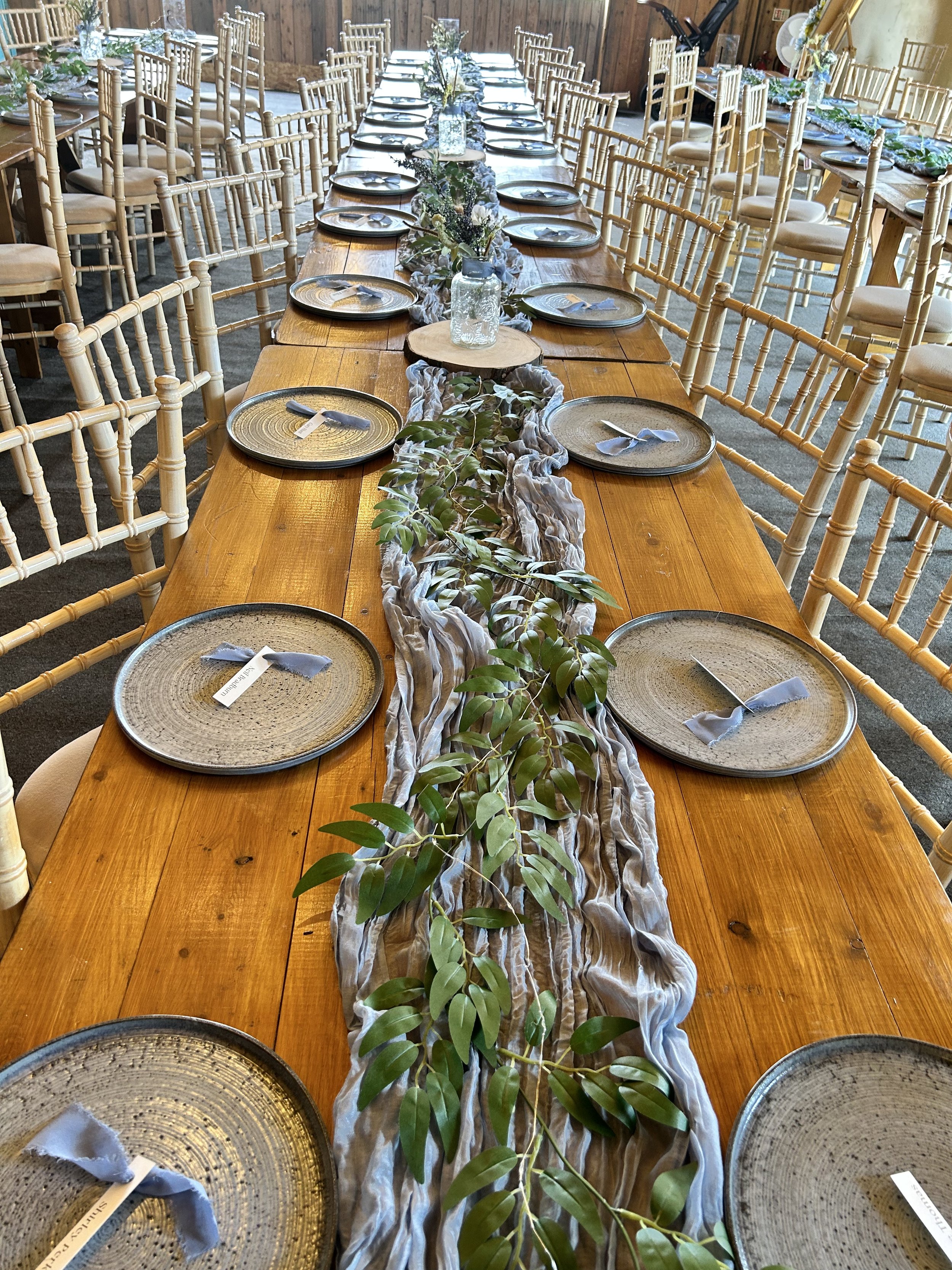 Tables set in our Cowhouse Barn for Leanne and Carl's Wedding at Stanford Farm, Shropshire on 26th of June 2024