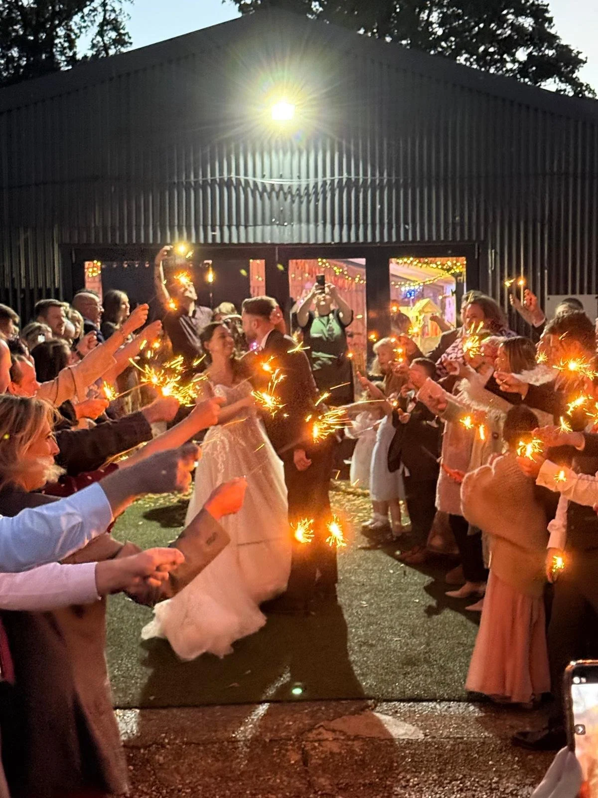 Evening sparklers at Emma and Andrew’s wedding at Stanford Farm in Shropshire on Saturday 4th October