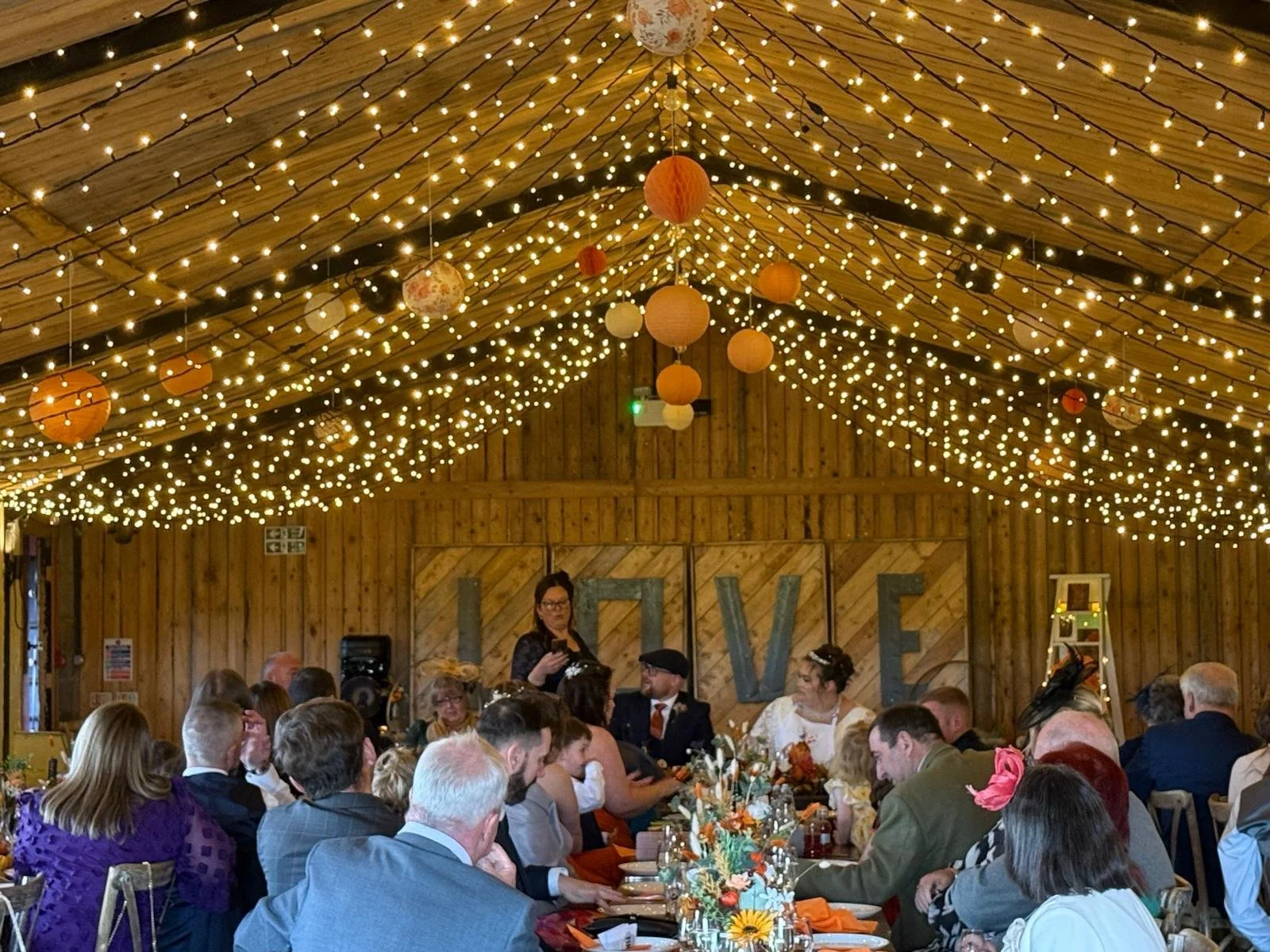 The wedding breakfast in the cowhouse barn - Natasha &amp; James’ Autumn Wedding at Stanford Farm