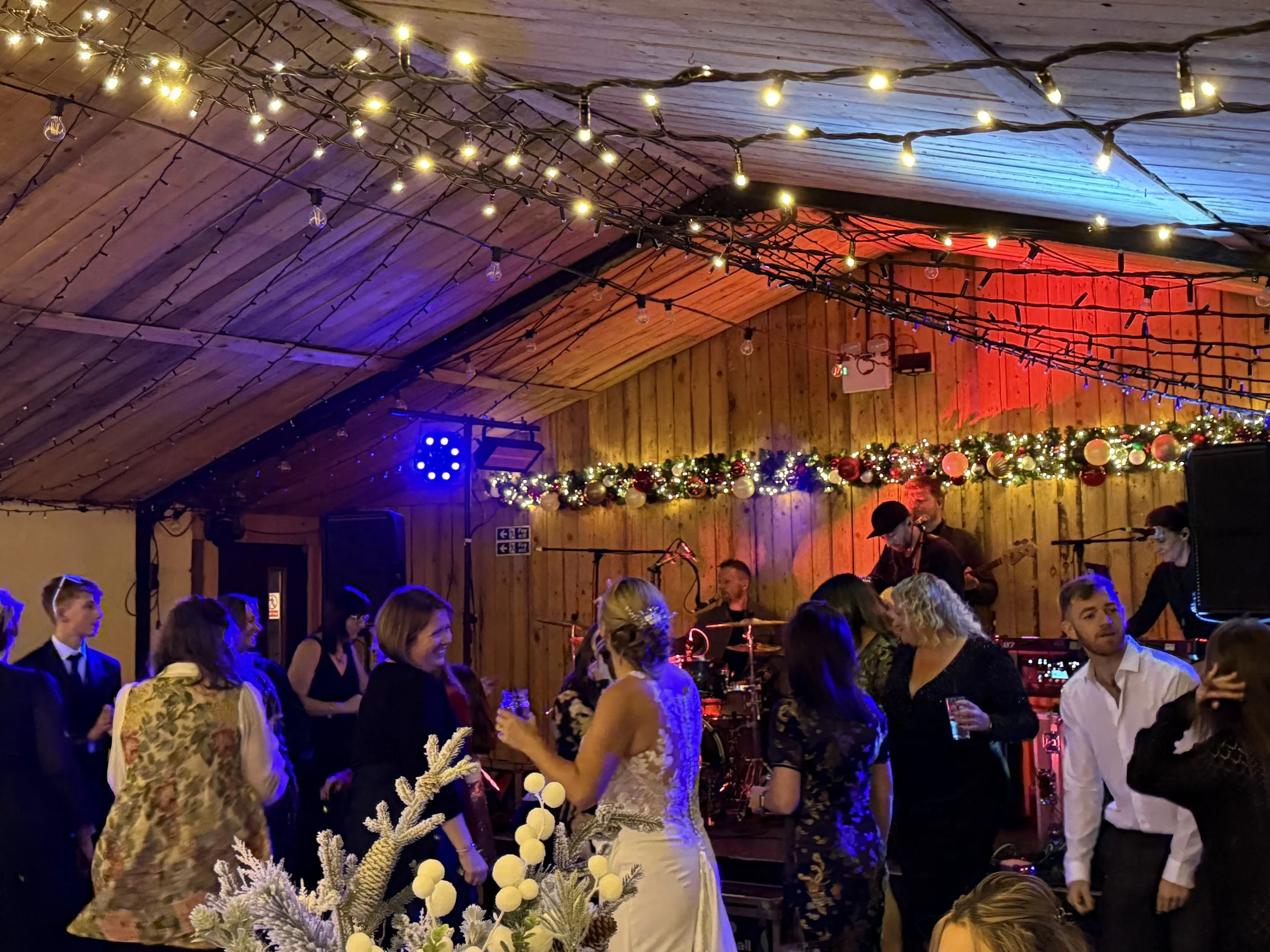 Dancing in the Cowhouse to live band Monstaball at Jodie and Wayne’s Winter Wedding at Stanford Farm 20th December 2025