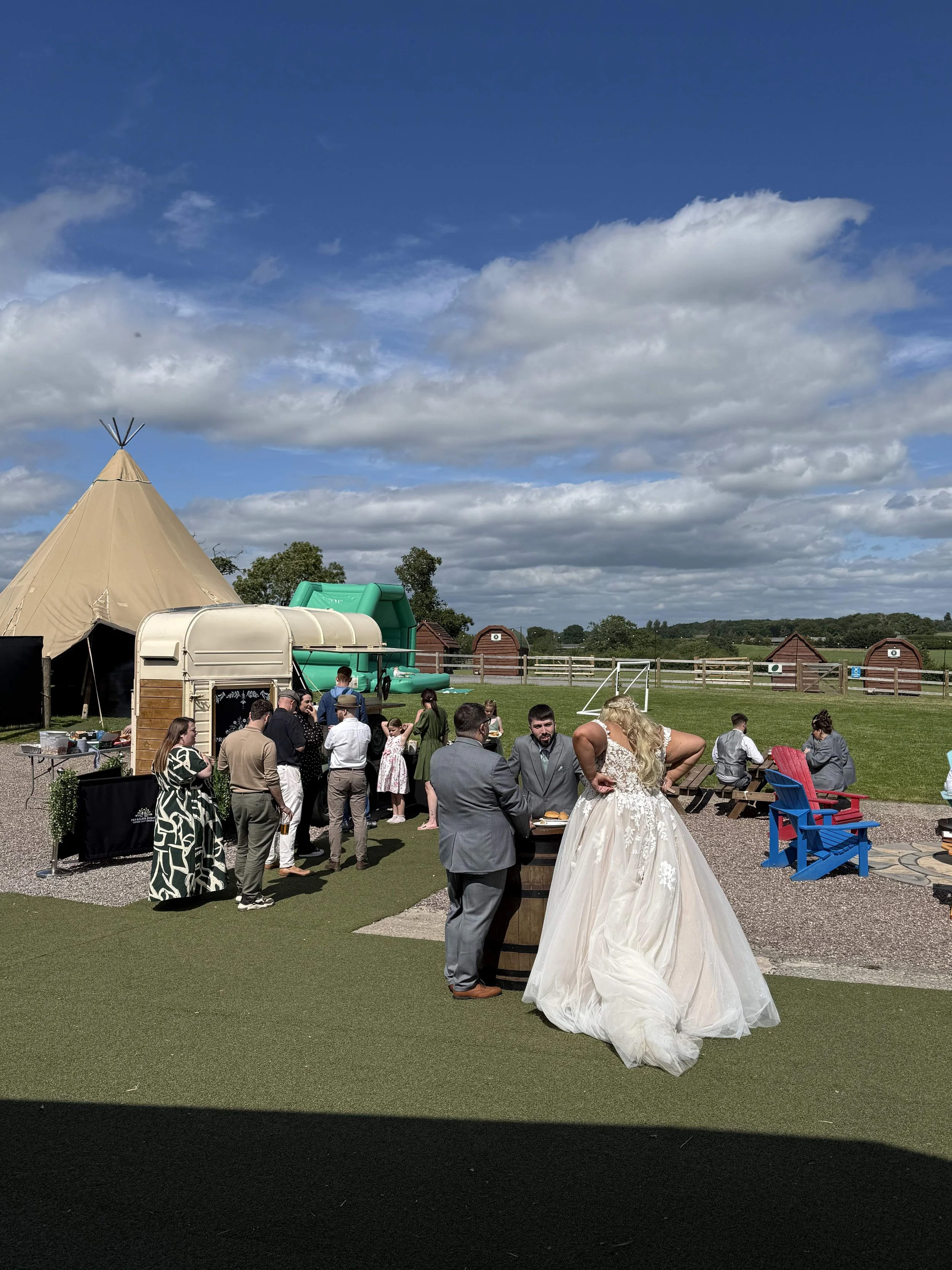 Out on the Oval Green at Charlie and Tom's Wedding at Stanford Farm