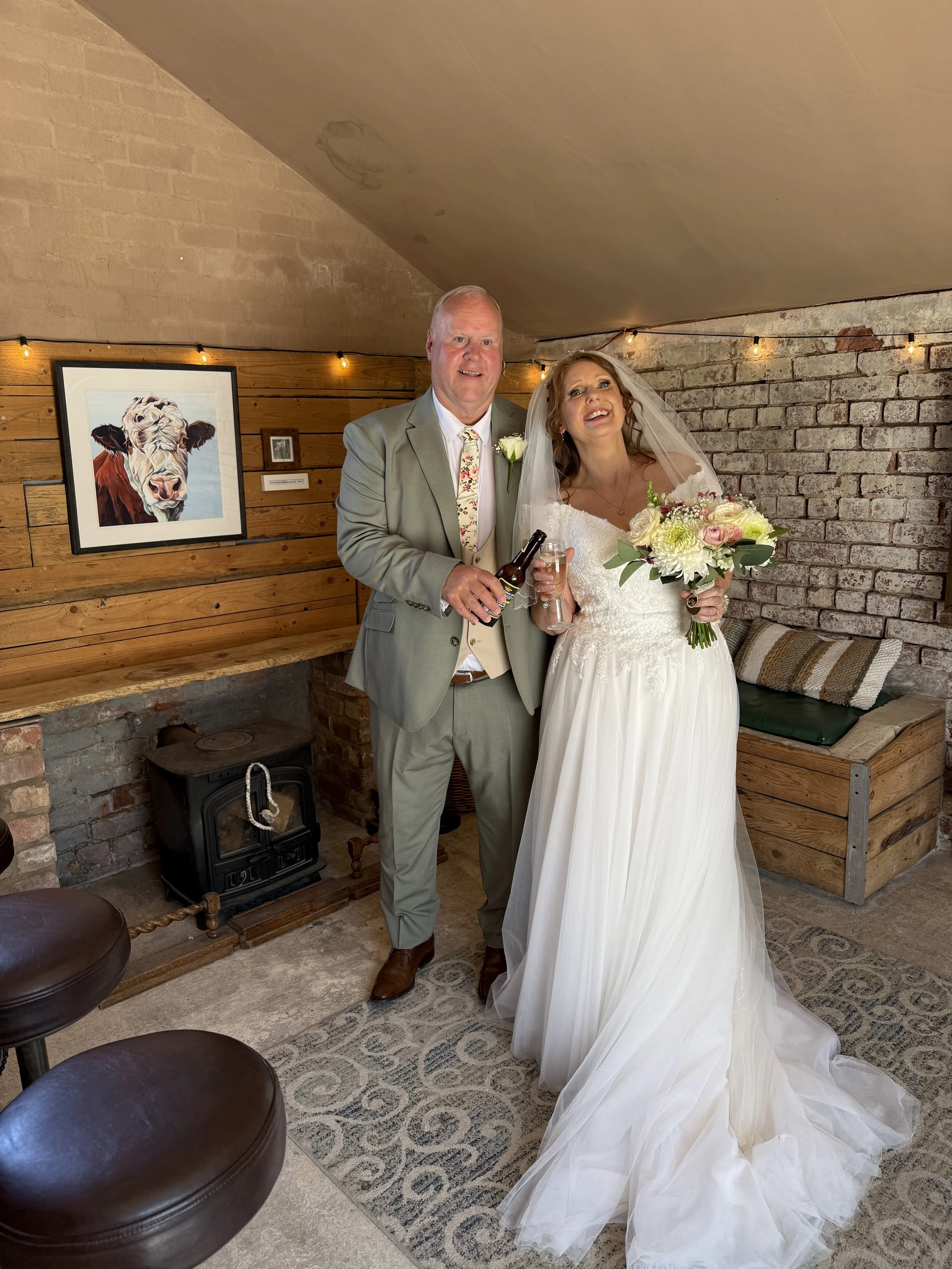 Emma and Steve in the Bull Bar at their Wedding at Stanford Farm