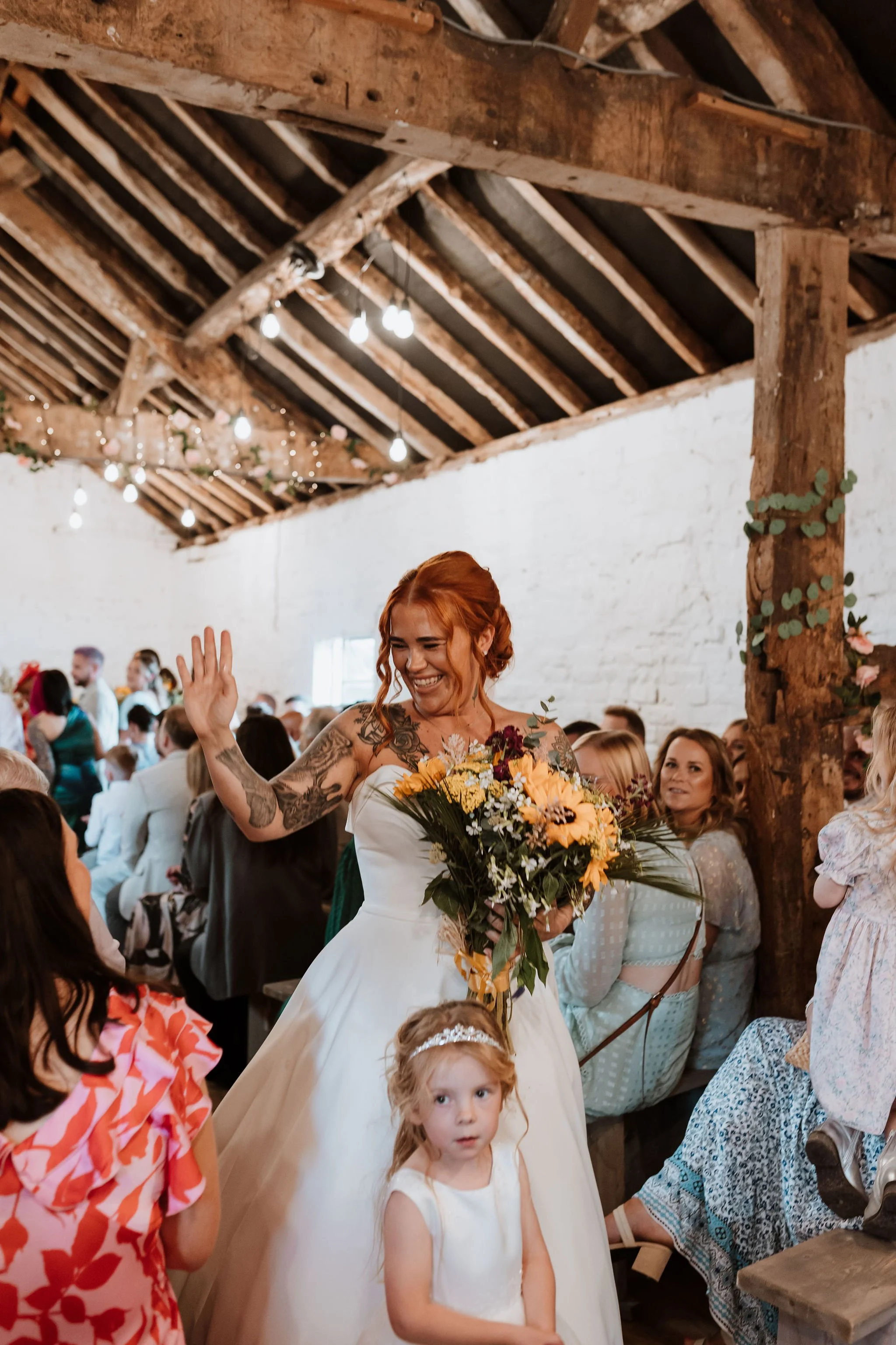 Happy Bride entering the Stables barn for an indoor wedding ceremony at Stanford Farm 