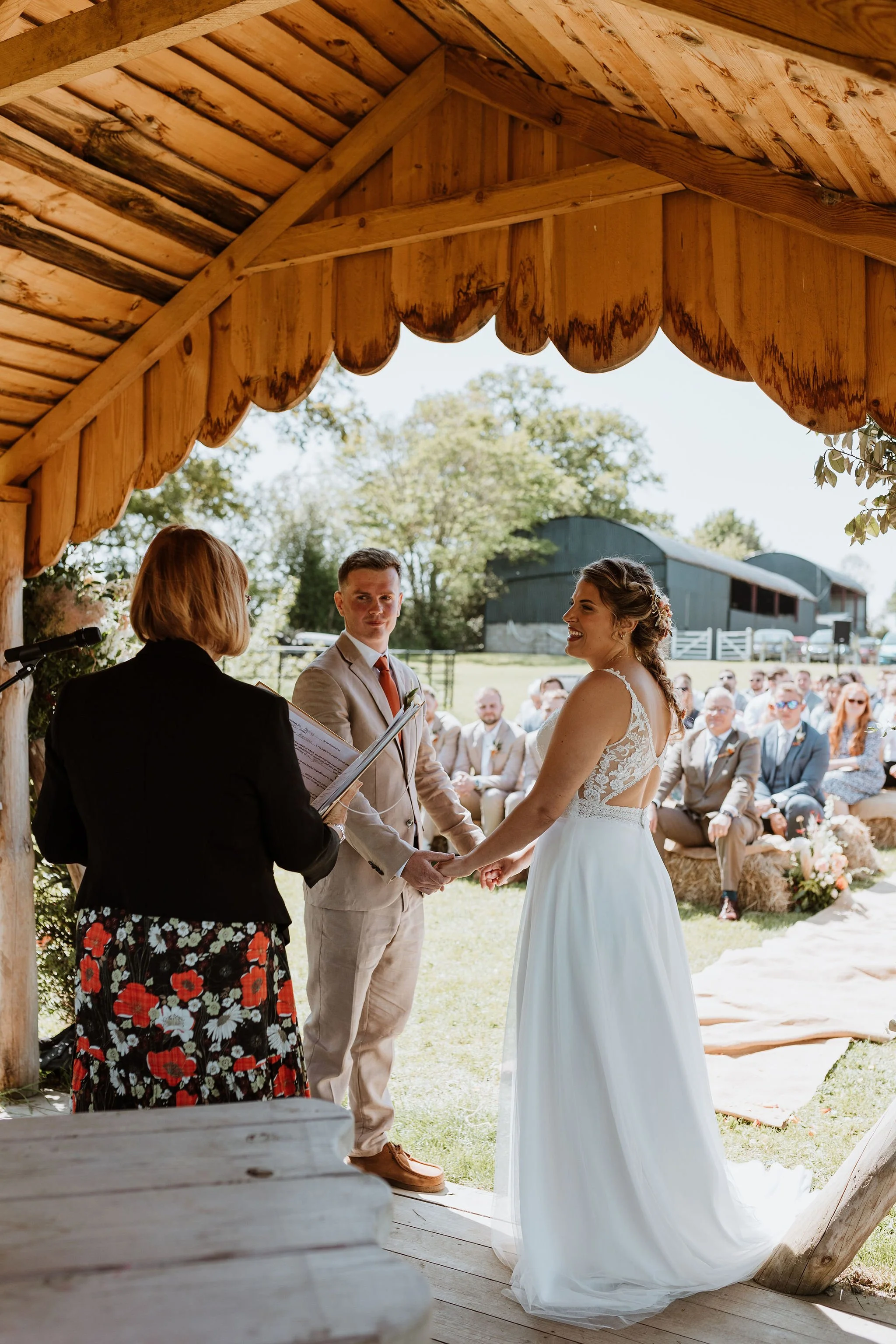 Bride and Groom during their outdoor wedding ceremony at the Lakeside at Stanford Farm