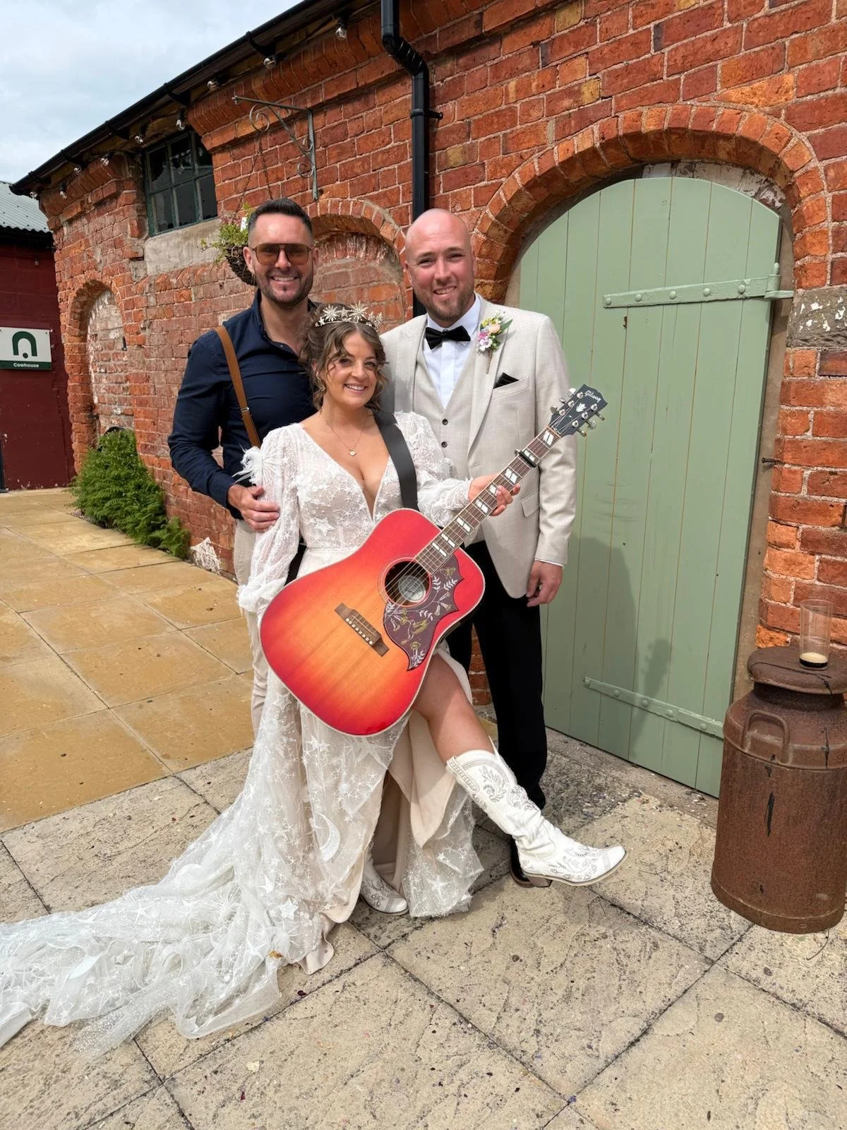 Bride and groom with live musician at their Stanford Farm wedding