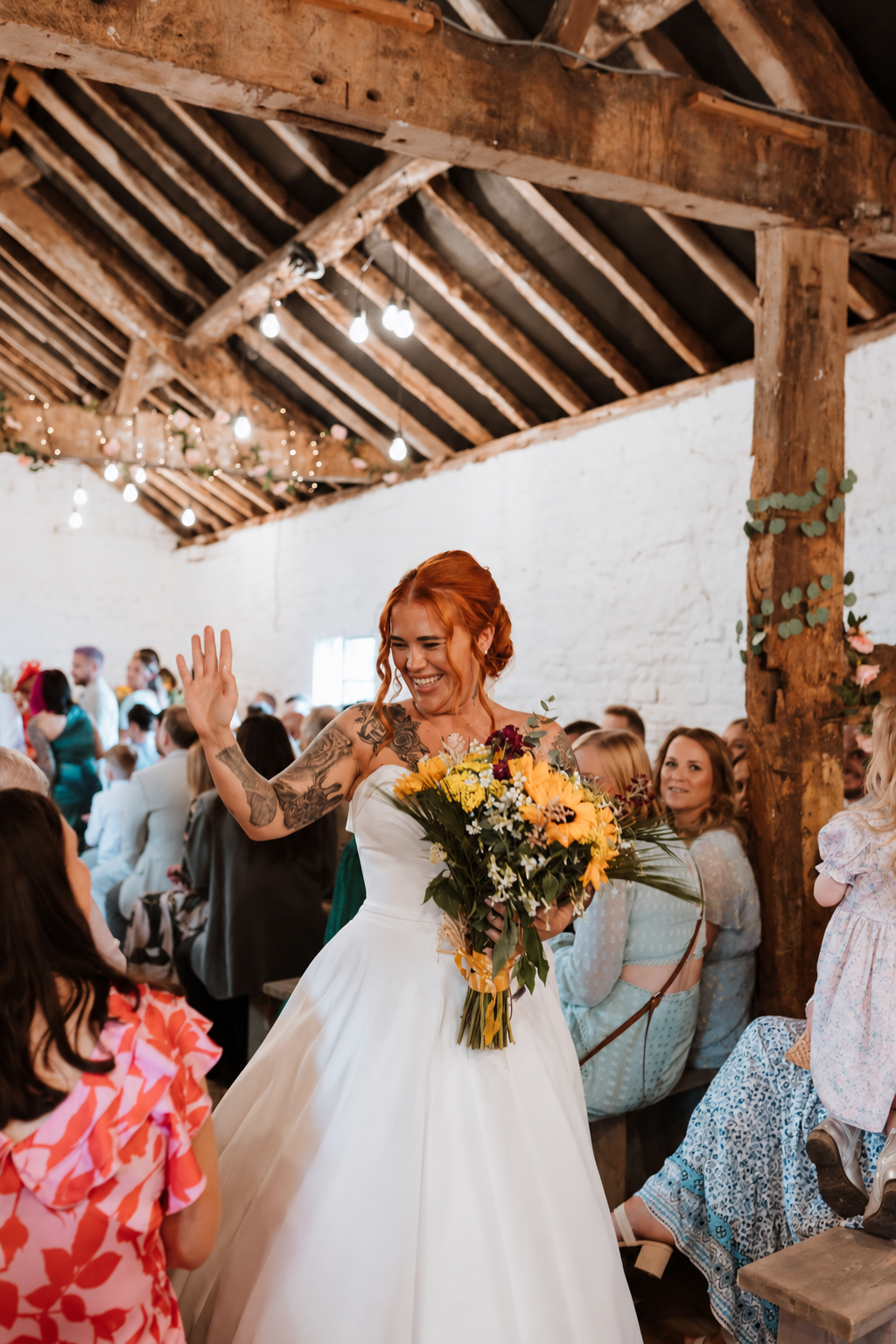 Happy Bride entering the Stables barn for an indoor wedding ceremony at Stanford Farm