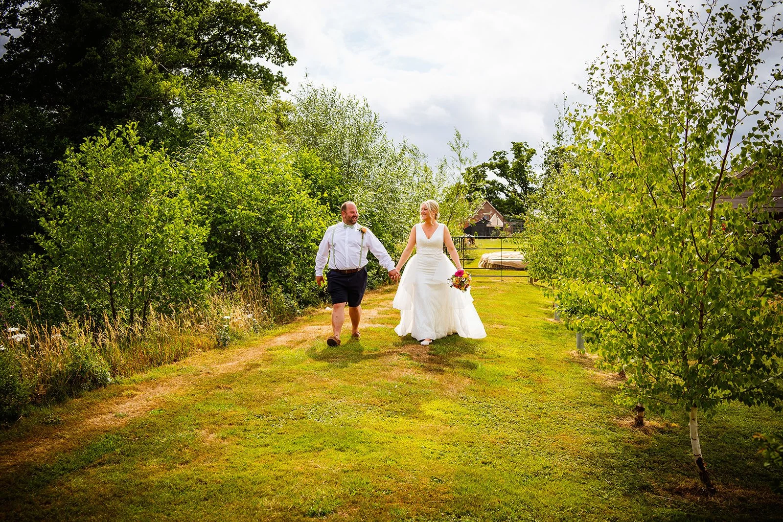 Late Availability weddings at Stanford Farm in Shropshire wedding couple strolling through the farm