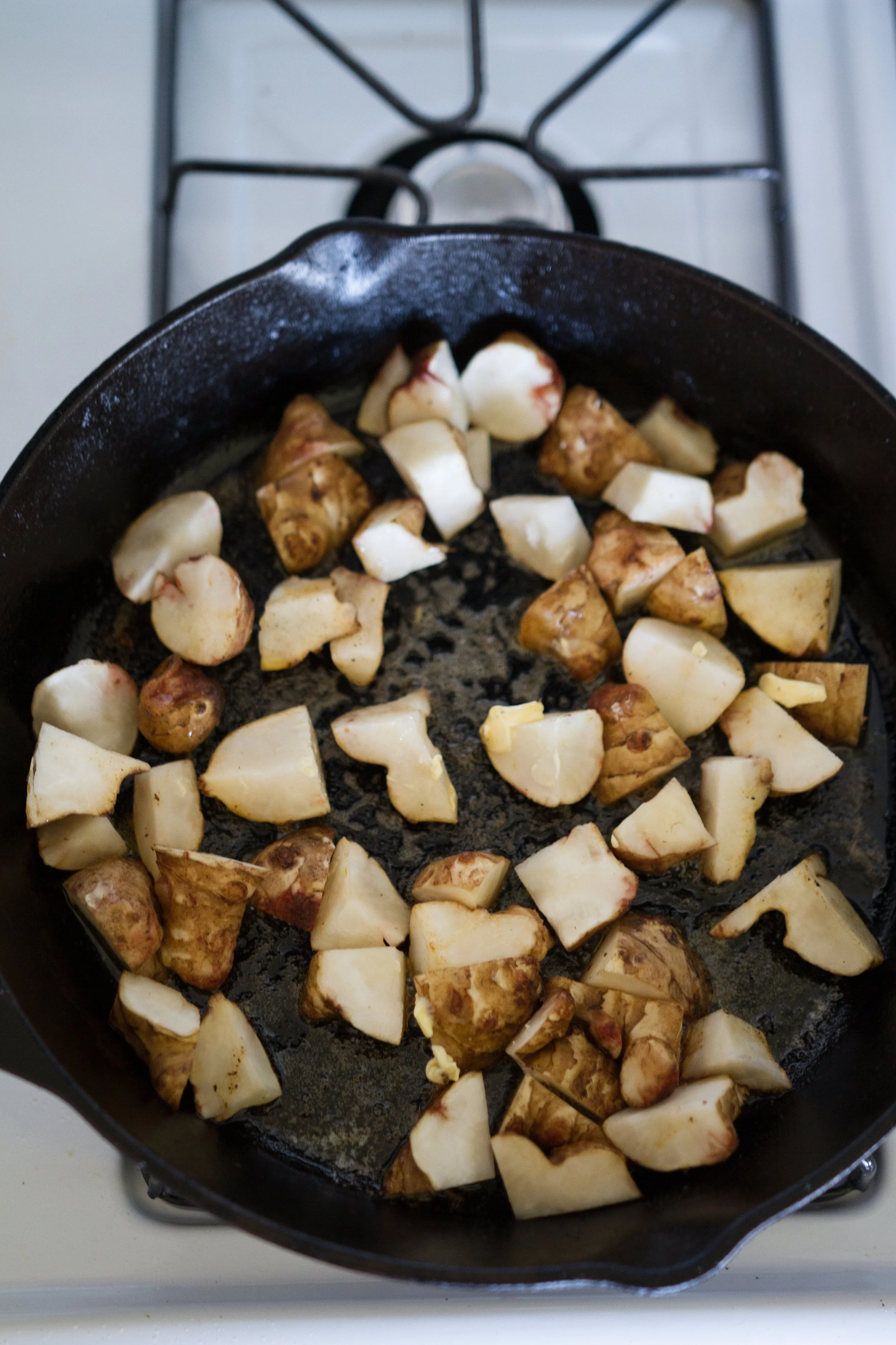Wait so what are Sunchokes aka Jerusalem Artichokes anyway? In recent years farmers markets across the country started stocking these freaky things. Then of course all the chefs started using them due to their versatility, simplicity, minimal prep time, and hearty profile. Since they are tubers they look like turmeric or ginger roots, and taste slightly nutty, but at the same time they taste like an artichoke heart and the best potato you've ever had.