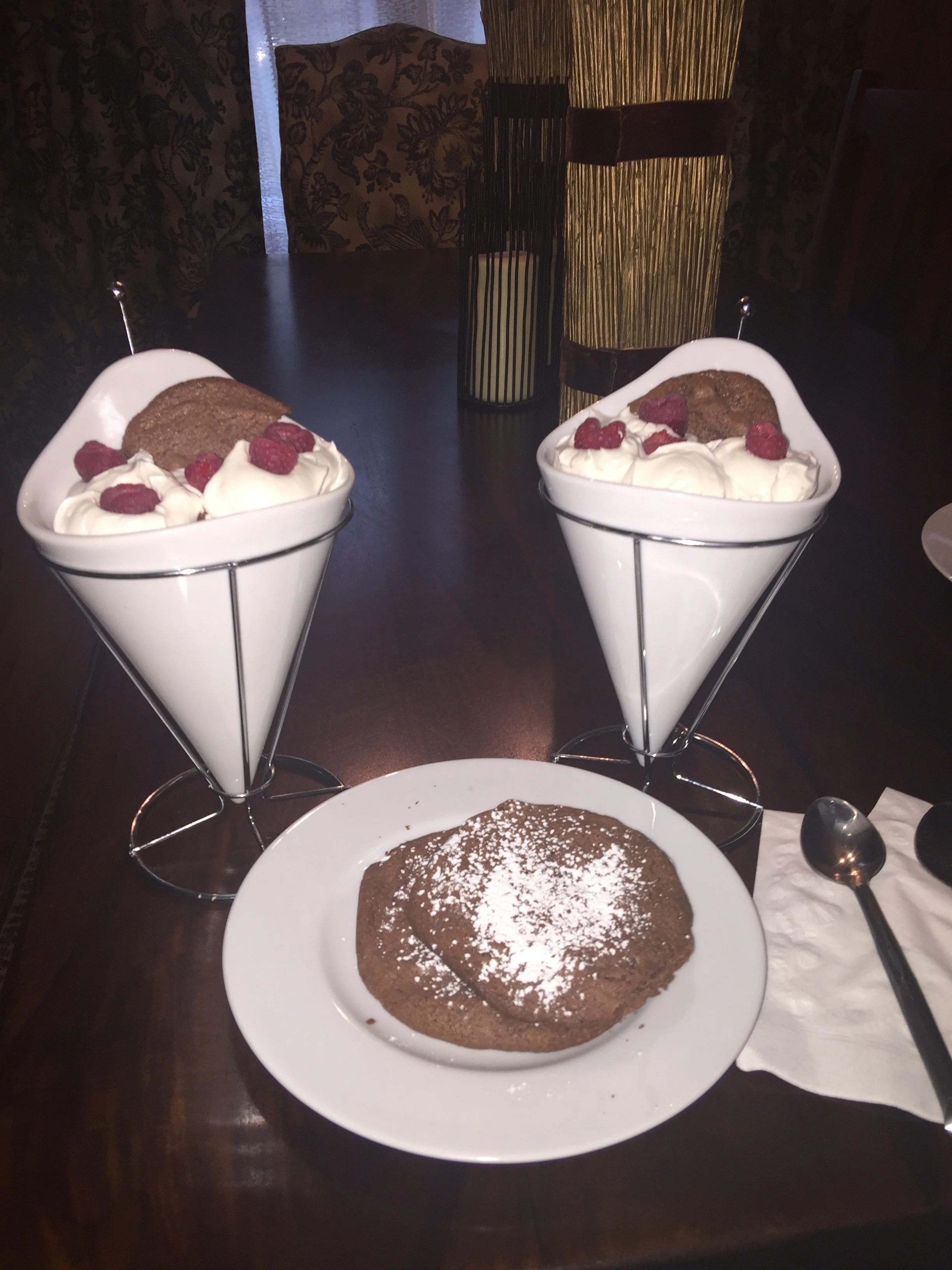 Brownie bites, fresh whipped cream, and raspberries