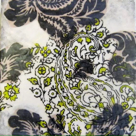 The paisley design is printed on the surface, then painted with oils and fused with a layer of encaustic medium and heat. 