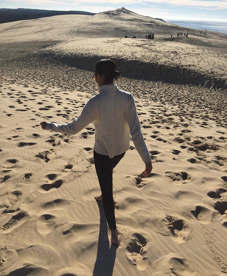 Me, in the now much despised sweater, trekking up to the highest point which you can see just ahead.