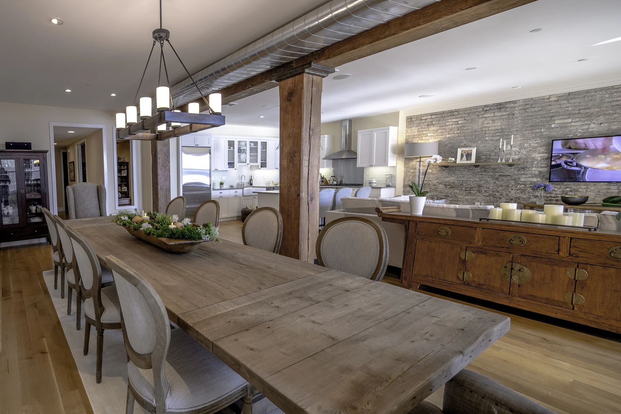 TUSCANY STYLE LOFT Through the use of natural stone, reclaimed wood and a calming color palette, Burgos created an old-world European charm that is polished and inviting.
