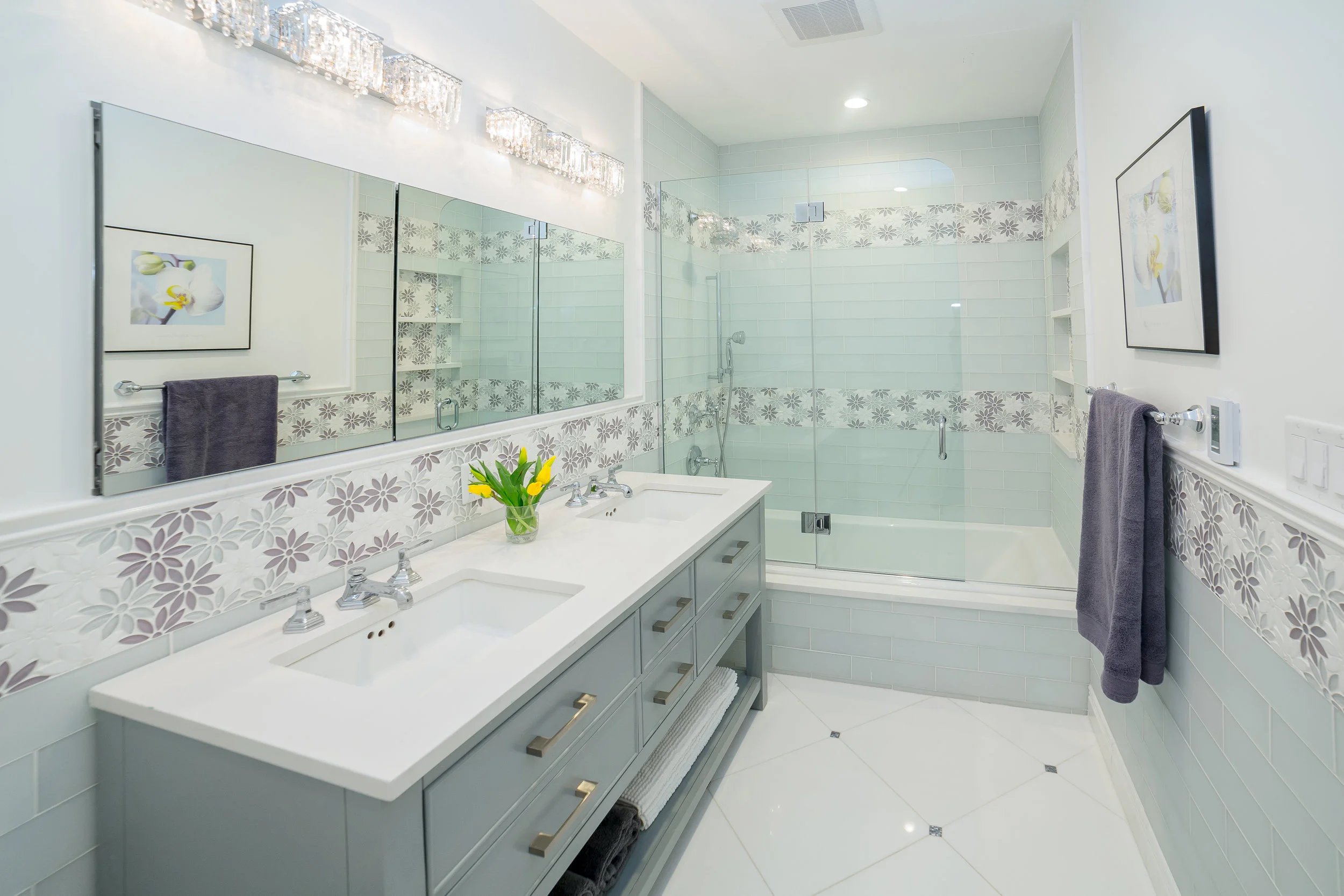 Designed by Marie Burgos Design - Photo Credit Francis Augustine Floor Tiles: Thassos Marble - Floor Accent Tile: Seashell Blocking mosaic - Accent Tiles: Gardenia Calliope Thassos and Glass Tile from Tile Bar 