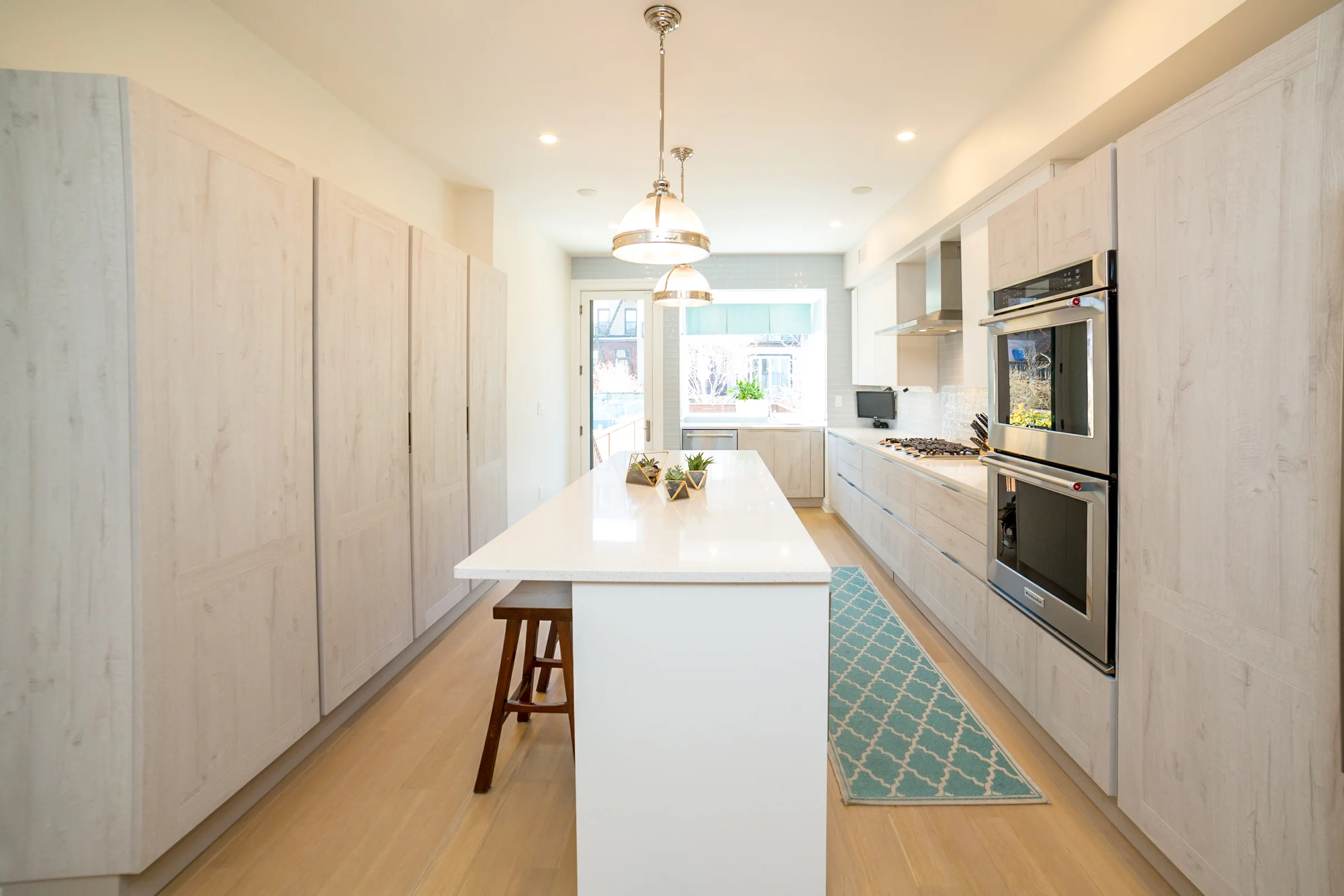 Garden Street Brownstone A Transitional design with Coastal color hues for a serene 1900 century family home.