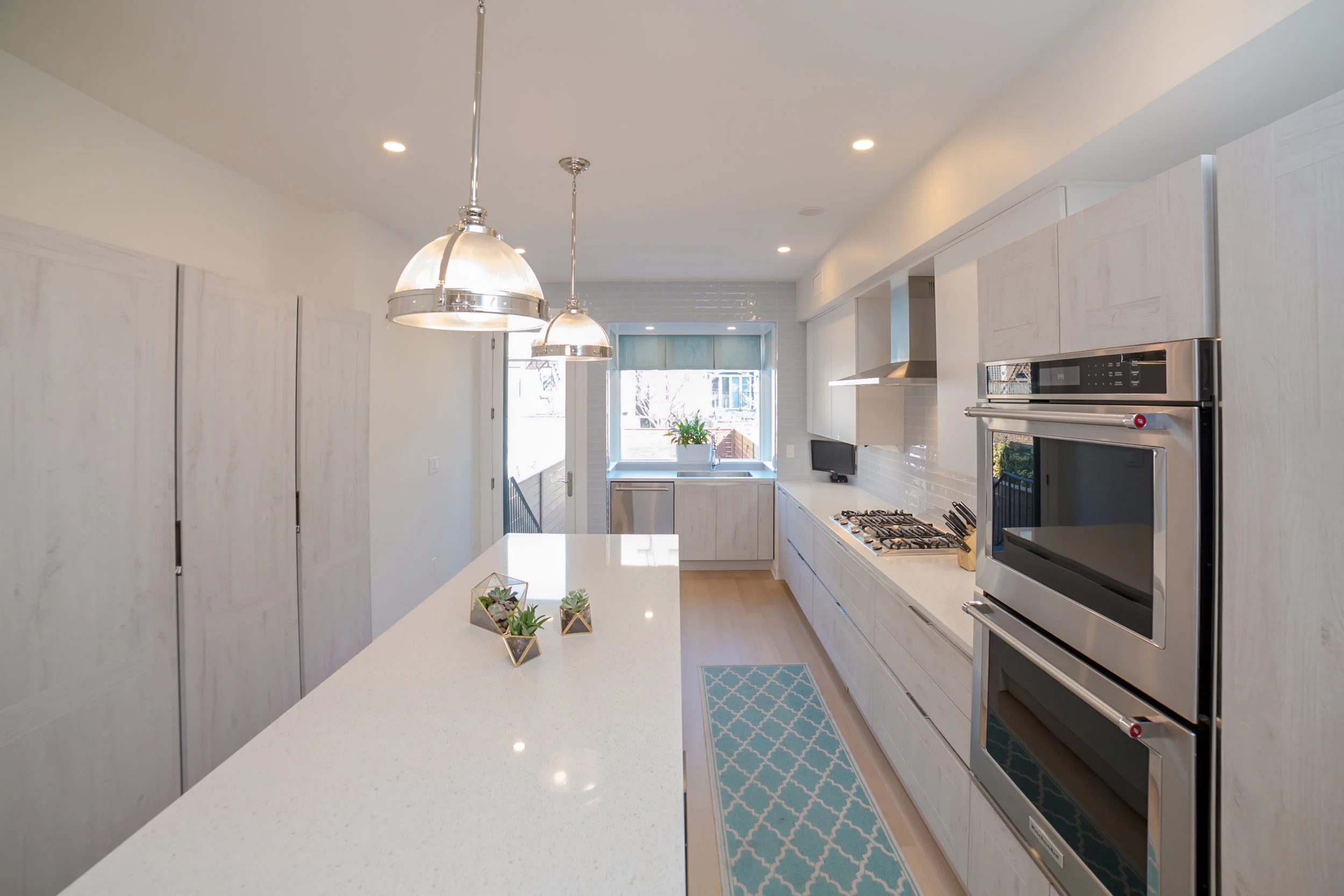 Garden Street Brownstone A Transitional design with Coastal color hues for a serene 1900 century family home.