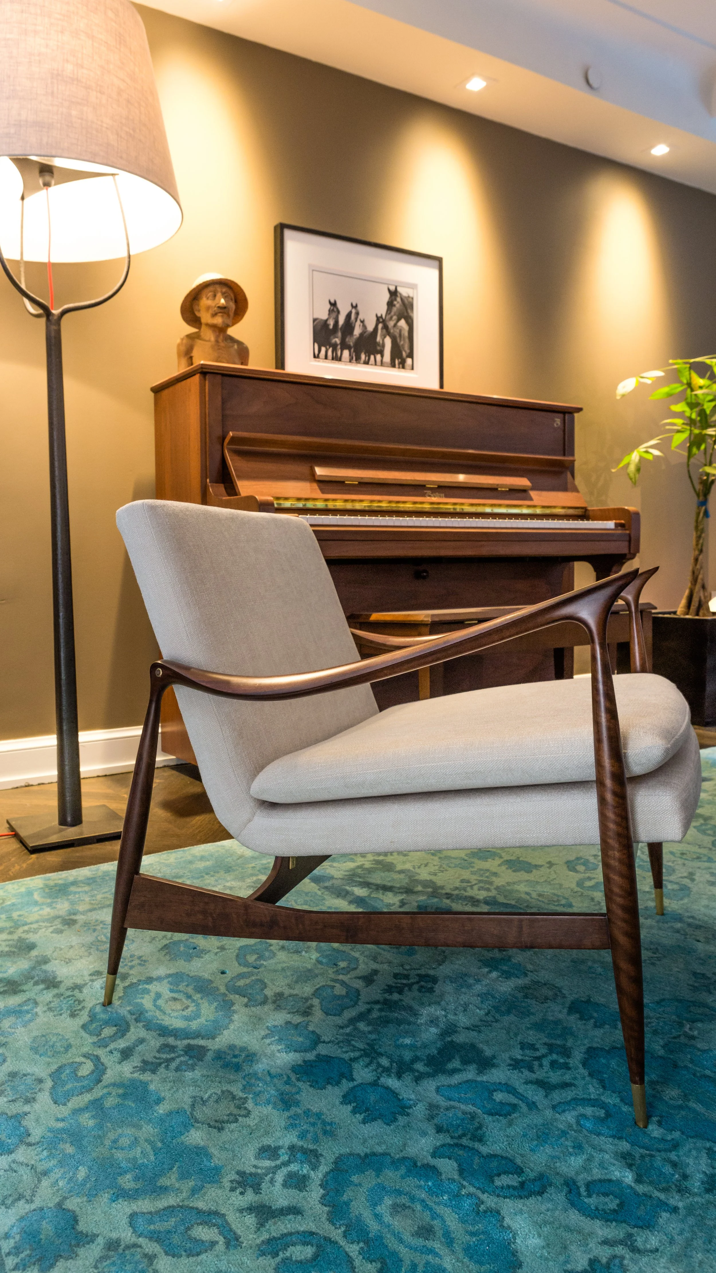 Warm table lamp lighting a living room corner in the evening