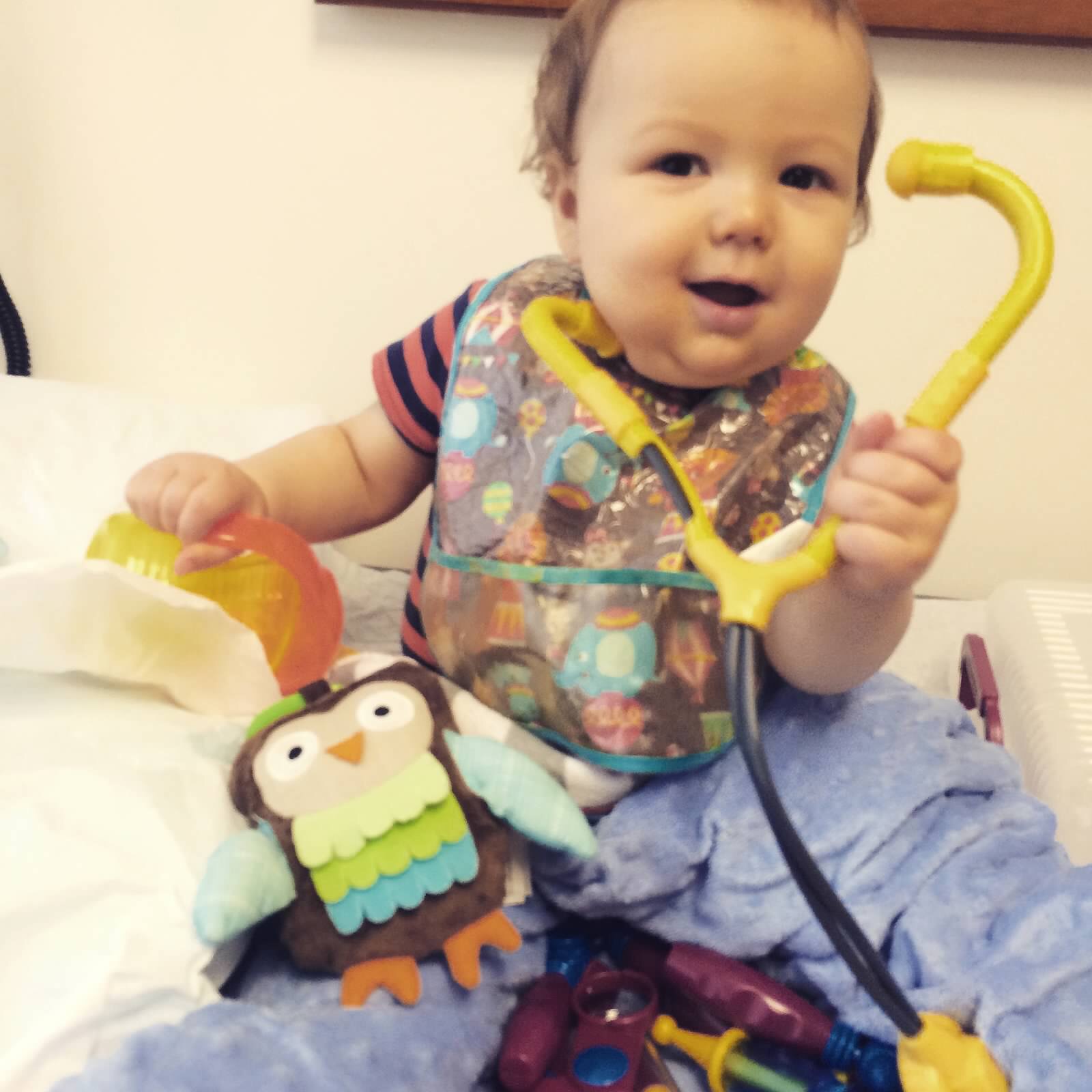 Luka, having fun while waiting for more labs in the clinic