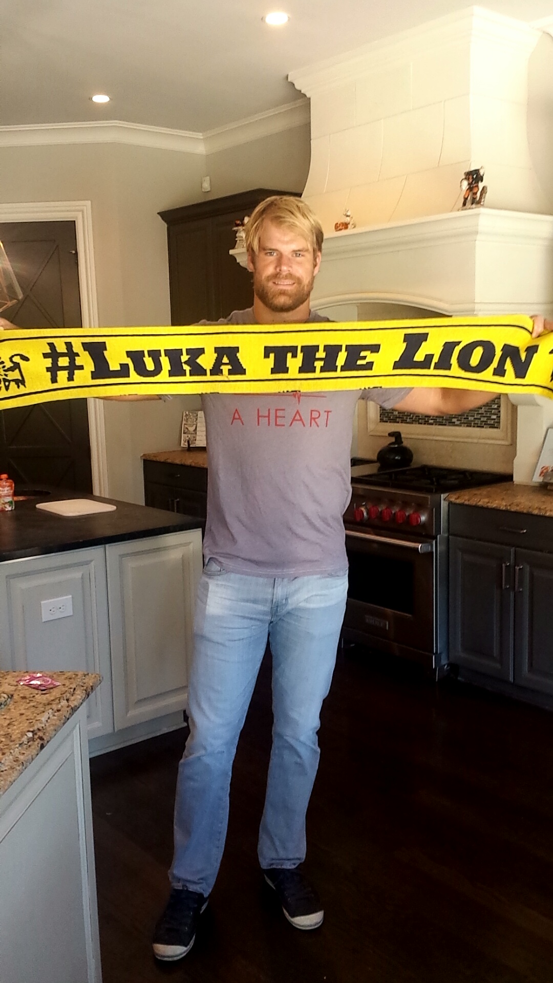 Carolina Panthers Greg Olsen showing his support through the #ScarfChallenge during the 2015-16 season