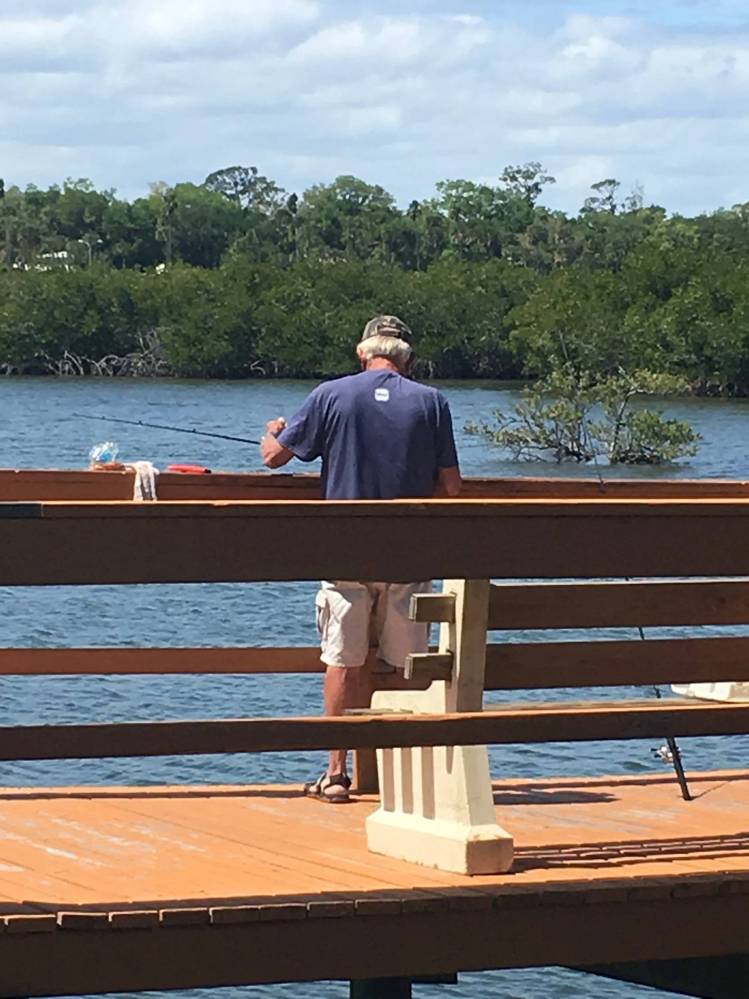 Jon NSB back view with rod on dock.JPG