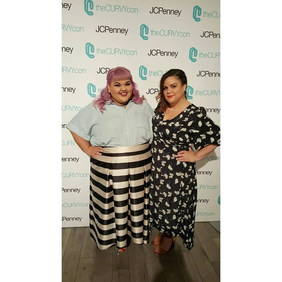 At CurvyCon with Ashley Nell Tipton , winner of Project Runway . Photographed by Su-Style.com . Dress by Eloquii .