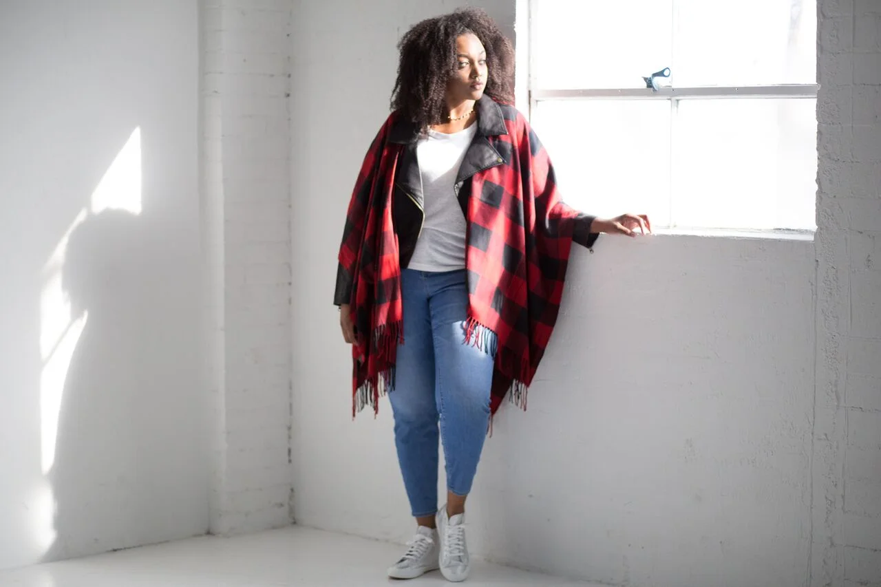 Jacket: Moto Op Jacket, $59.99; modcloth.com . Poncho: Cozy Campside Plaid Shawl, $27.99; modcloth.com . Top: Boyfriend Pocket Tee, $10; oldnavy.com . Jeans: Mid Rise Rockstar Skinny Jeans, $27; oldnavy.com . Sneakers: Here's the Kicker Sneakers, $52.99; modcloth.com . Necklace: Courtney Triangle Choker, $32; oliveandpiper.com .