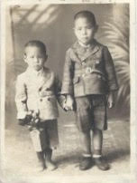 On the left, as a young boy in the 1940s
