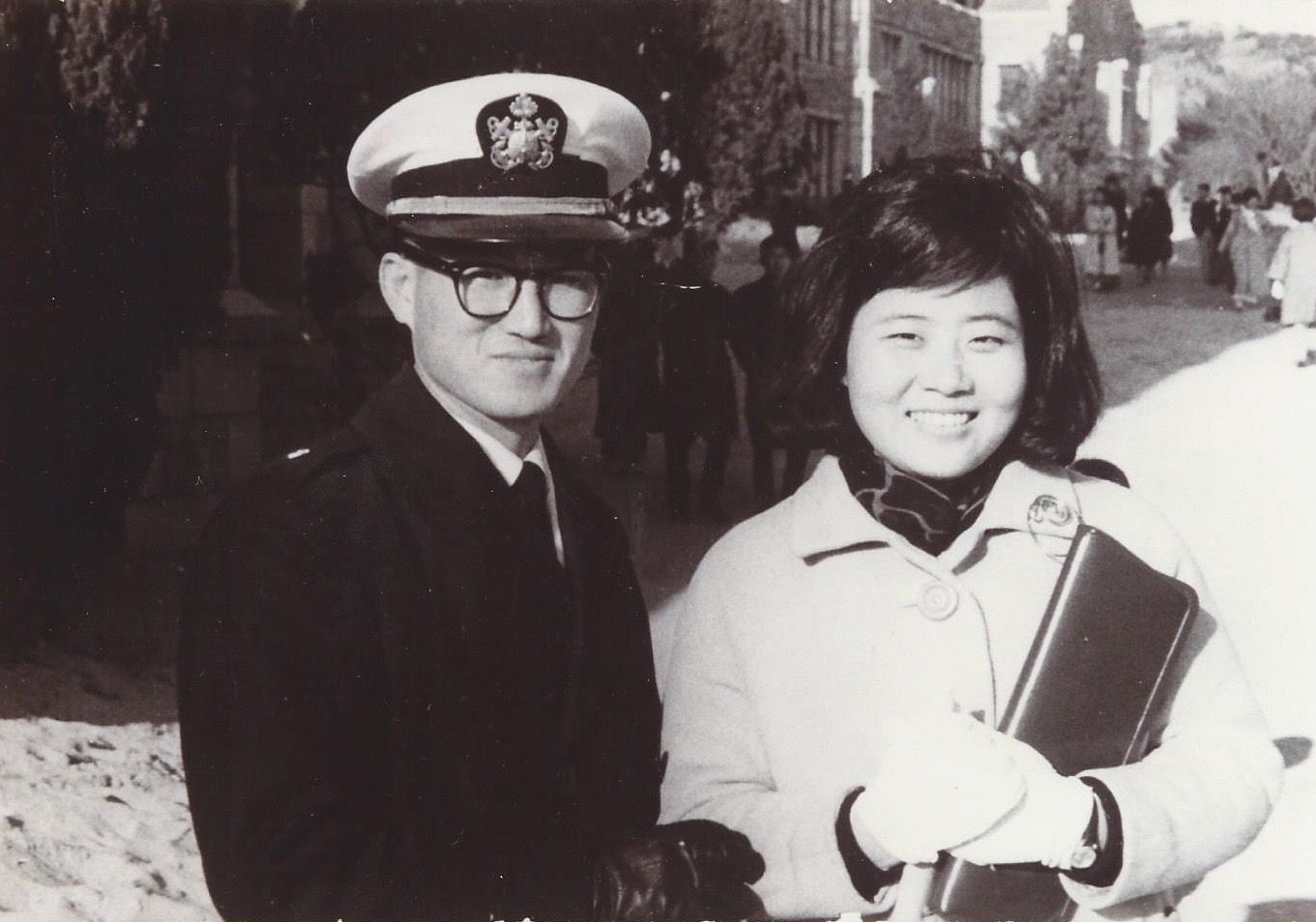 At his wife's college graduation, in his Navy uniform