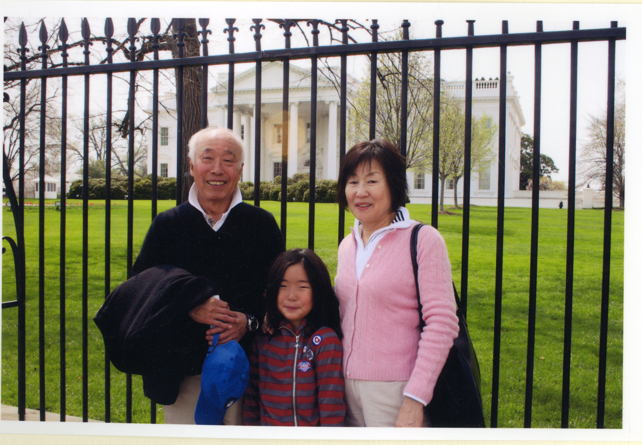 With Kook Dong Pae and their grandchild, Chloe, in Washington, D.C.