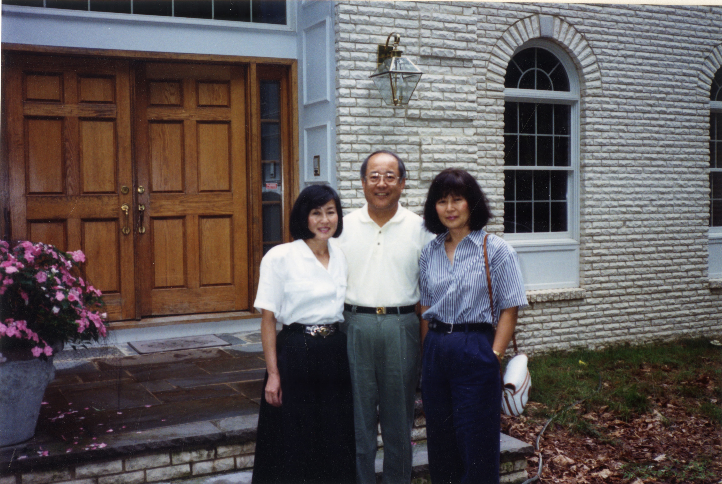 With her sister and brother, 2001