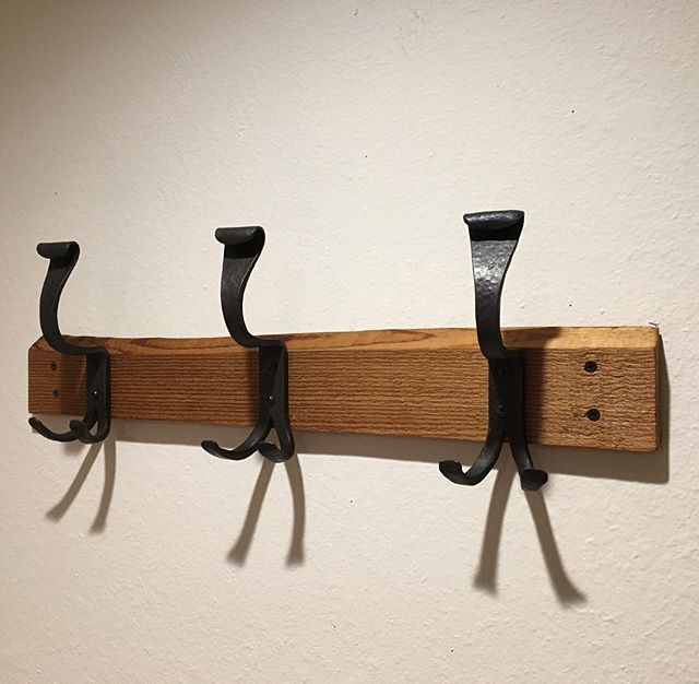 The coat rack I made for my daughter and her bf for Christmas- finished and hung! I like how the hooks I forged look vaguely like camels. (unintentional) #womenblacksmiths #forging #blacksmithing #forgingfun