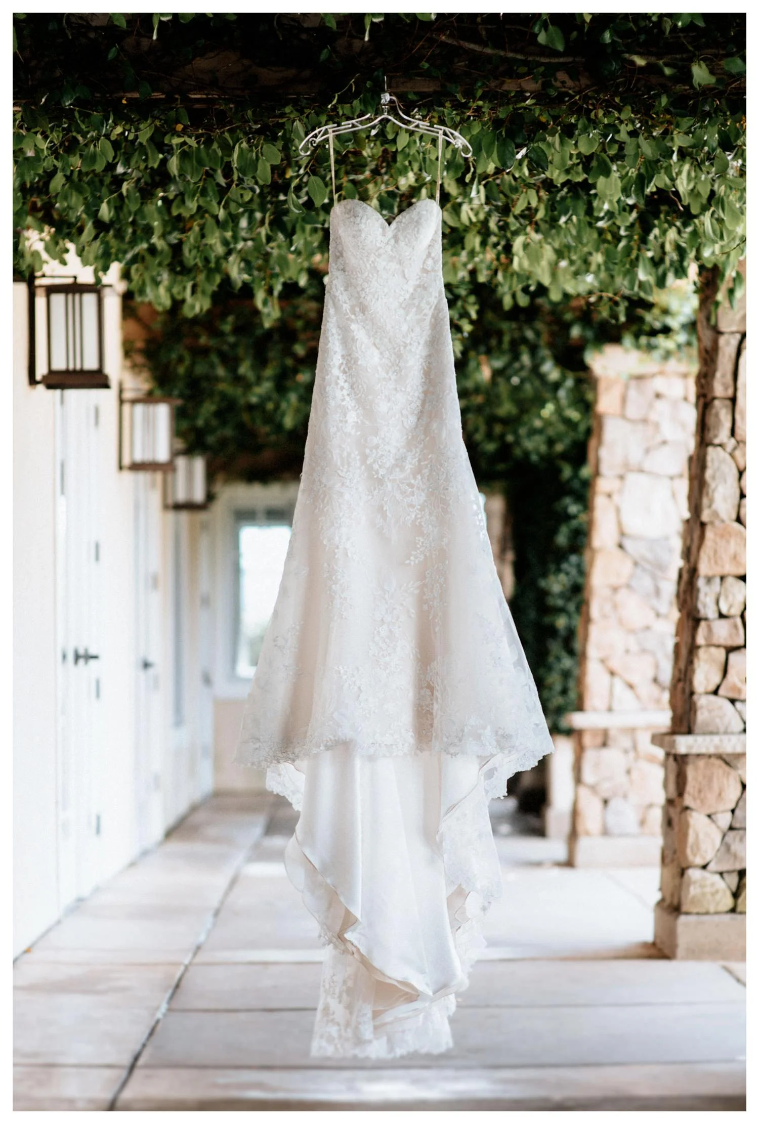 A wedding dress hangs in the breeze at Twin Oaks Golf course in San Marcos, CA