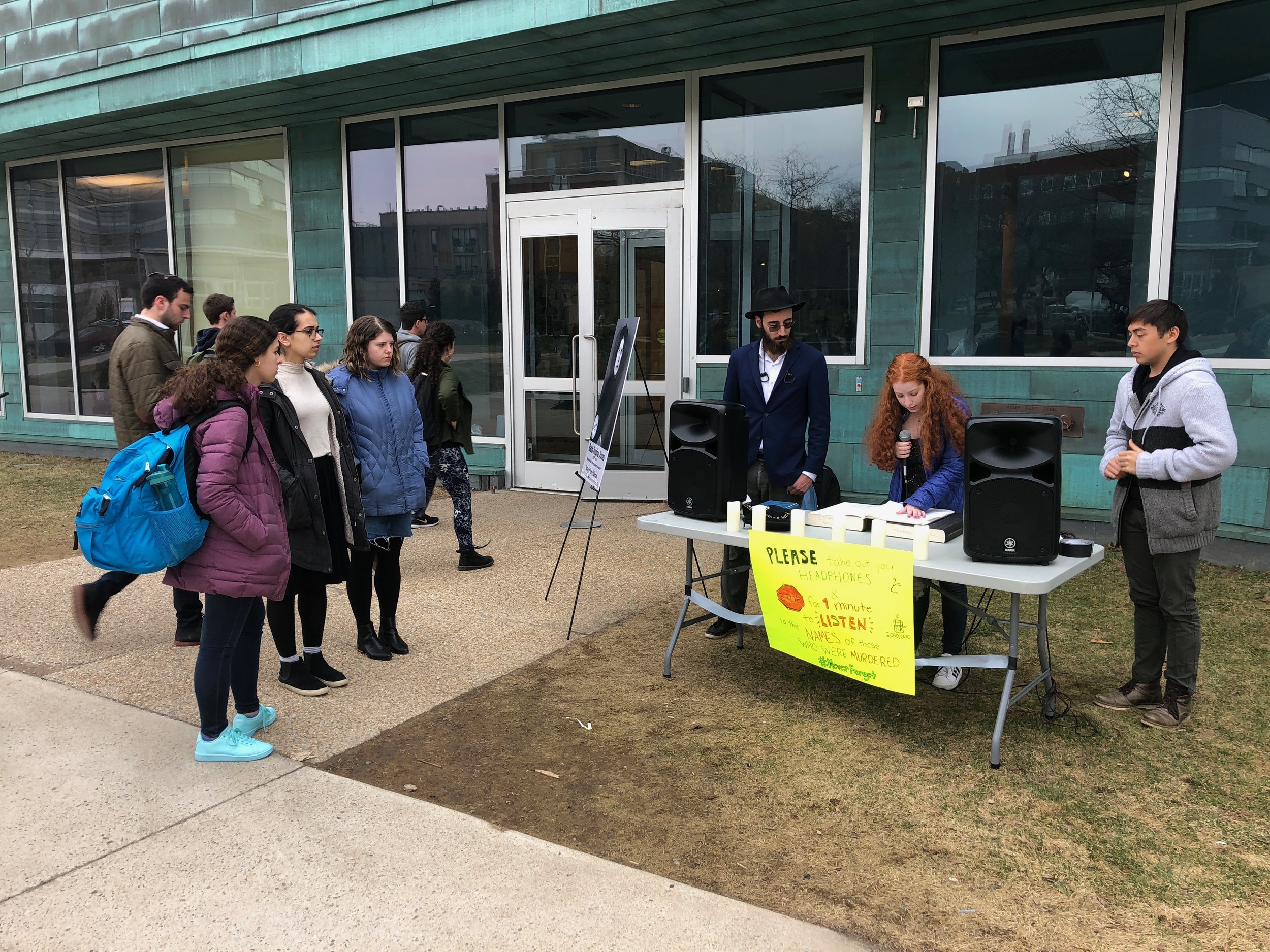 Students read the names of victims for six continuous hours in a program called "Six Hours for the Six Million"