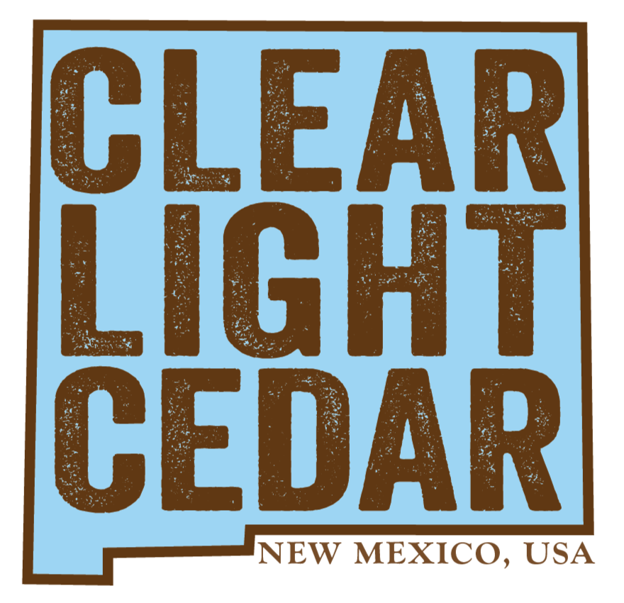Sign with text 'Clear Light Cedar' and 'New Mexico, USA' at the bottom, indicating a cedar product from New Mexico.