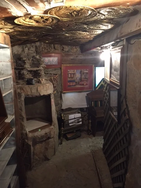 old stones, concrete, and various junk items RE-PURPOSED to make a really cool hall area.