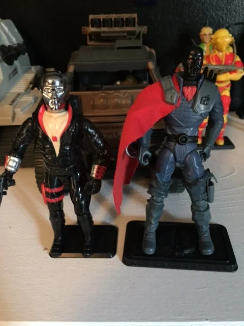 1983 Destro beside a circa 25th Anniversary Destro figure. I really hate the black mask destro and I'm not sure why he's in my collection. i think he came in a multi-pack or something.