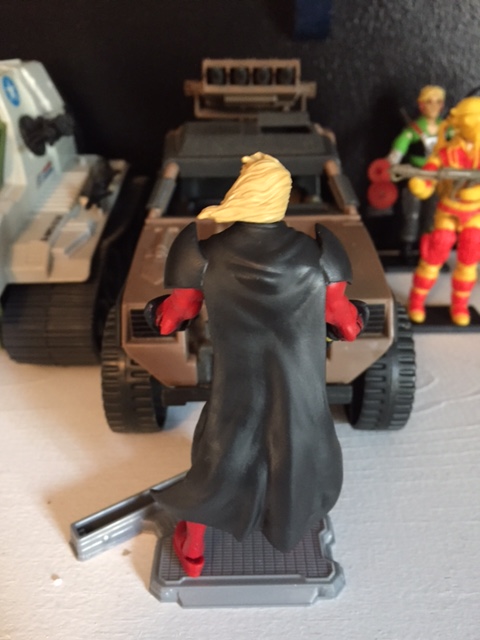 the hair looks even worse from behind. the cape is molded close into the body so at least he stands up ok on an action figure stand unlike so many of the marvel UNIVERSE / marvel legends figures.