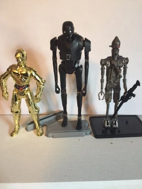 K-2SO stands considerably taller than most other star wars 3.75 inch action figures. here he is shown with the similarly constructed IG-88
