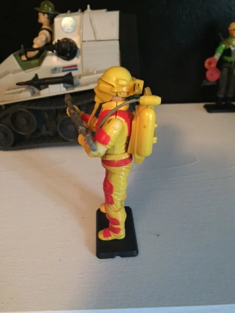 Profile of Blowtorch. his protective mask looks really cool in profile and you can see the flamethrower plugged into the front of the backpack.