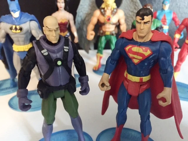 Lex Luthor in his classic super friends purple, black, and green outfit verses the best 3.75" superman (except for the big hands).