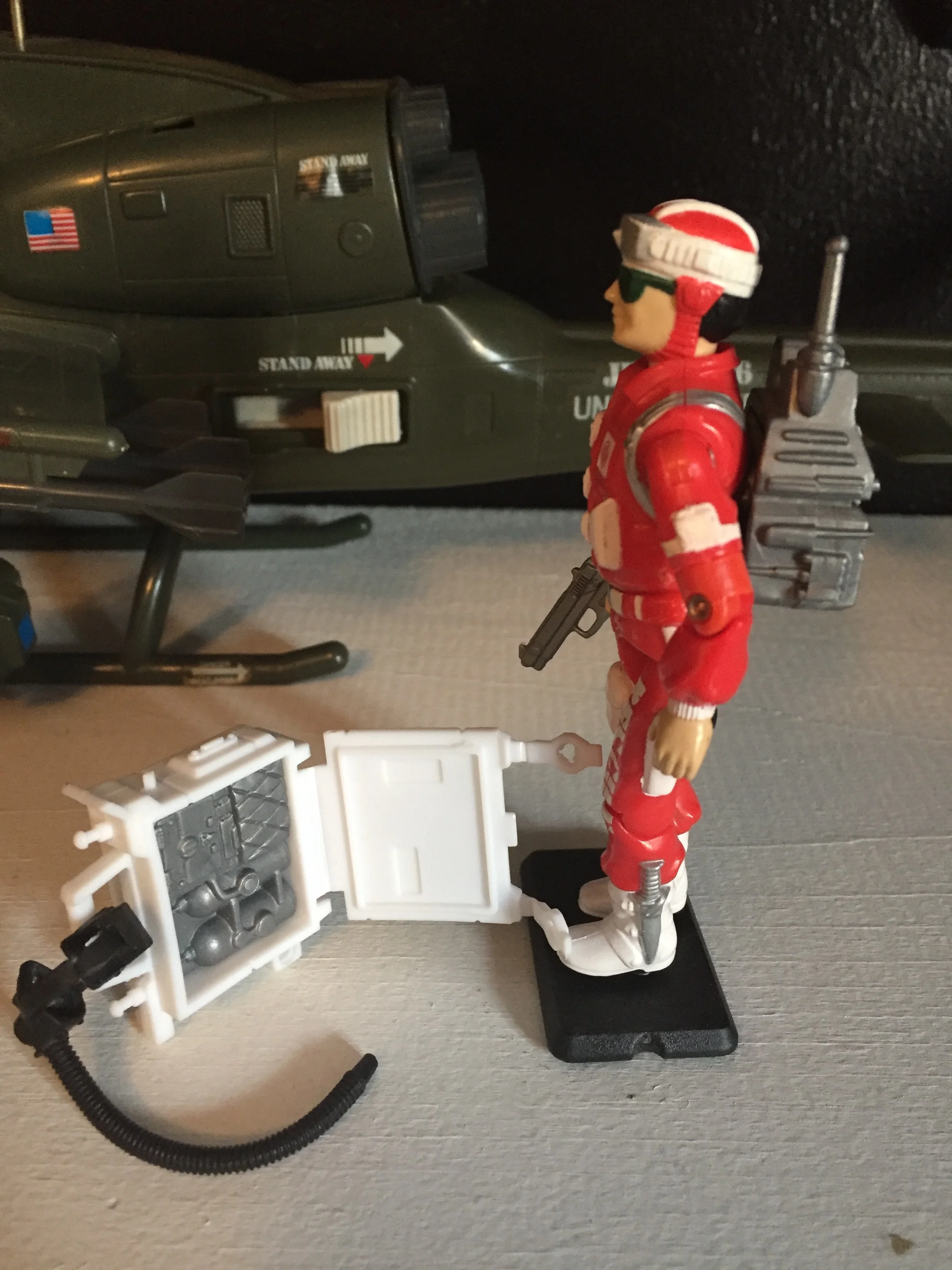 Side view with oxygen tank back pack opened up to show detail inside.