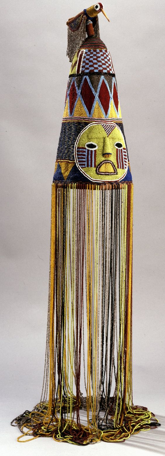 Beaded Yoruba crown. May I also add that I sometimes we get caught up in the whole "African Aesthetic as Fashion" and forget that some of these are part of customs that should remain as such not TRENDS This isn't directed to just the appropriating white folks but my Africans and blacks in the diaspora. A couple months ago I came across an instagram post of an individual wearing a replica of this with a very disturbing hashtag 'I set the trends' or something along those lines. I was about to respond but got caught up with something I was doing at that moment and totally got sidetracked. Unfortunately, I couldn't find the post later. That post could have been a teachable moment for people that come across it if she perhaps focused on; 1... why this artifact is "chilling" in a British Museum?😏 2... The group of people it belongs to:Yoruba in this case 3...Its use: Worn by Yoruba rulers 4...Artistical perspective like the significance of the bird: According to the Yoruba belief, god places the bird on the head of a man or woman at birth as the emblem of the mind. ...And I could go on but to reduce this to a hashtag of TREND reveals the doubts harbored by many continental Africans about reconnection 🤷🏾♀️ Reconnection that is indeed vital !!