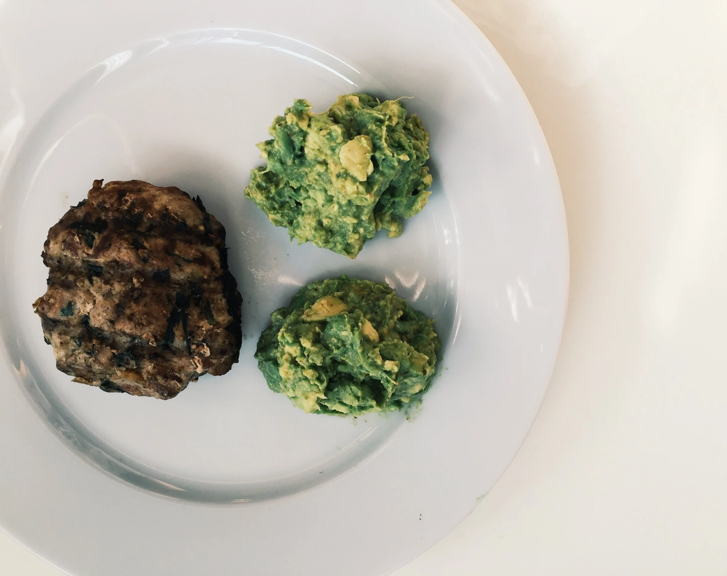 Here's a typical ketogenic breakfast. Organic turkey burger patty with some guacamole on the side. 