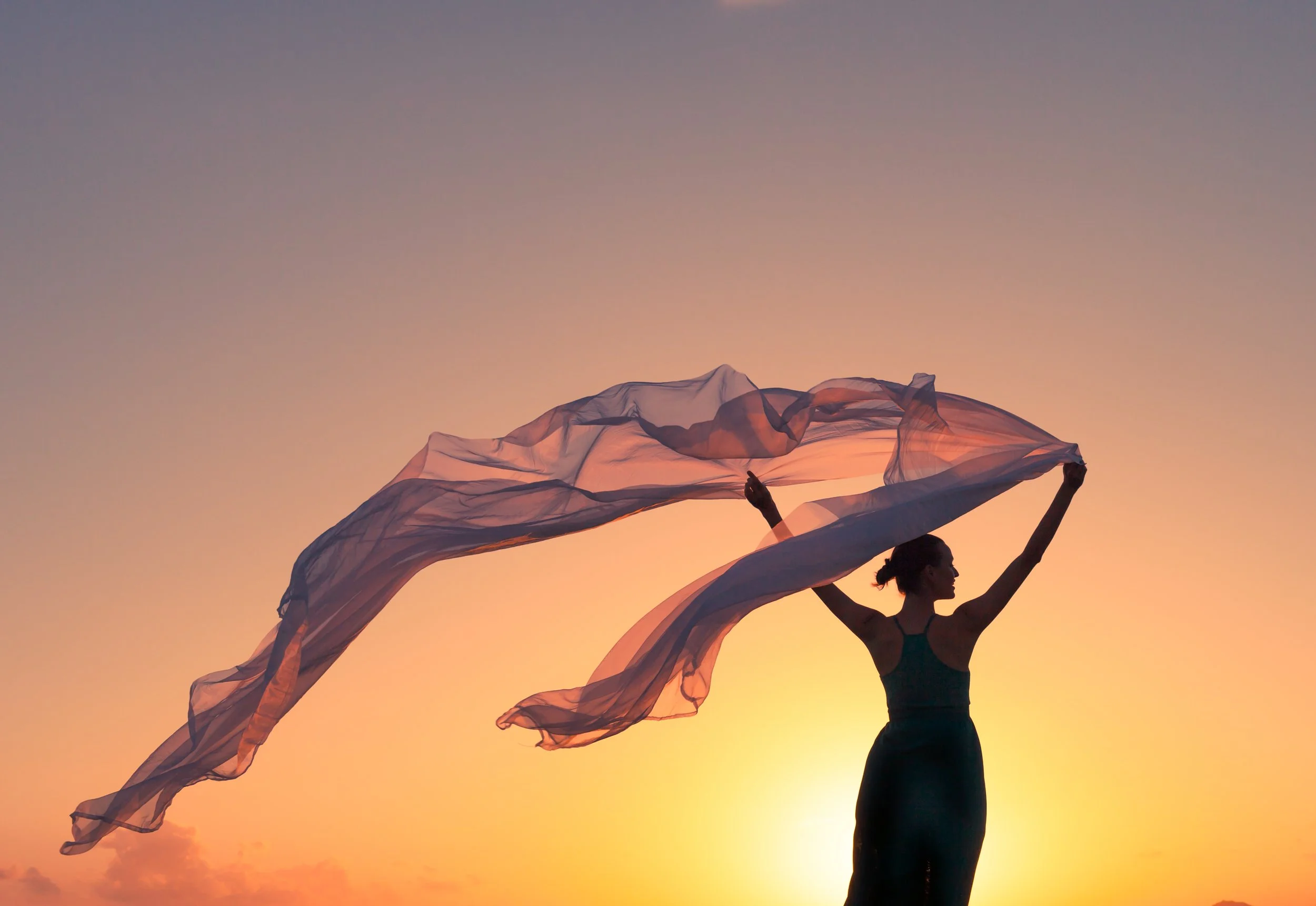 Beautiful-woman-holding-silk-cloth-in-the-wind-667313082_4111x2832.jpeg
